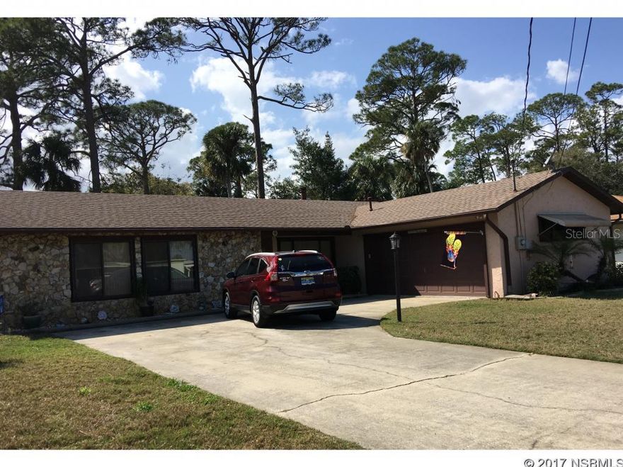 REDUCED AGAIN!! Seller says it's time to sell. This house has great flow for family get togethers. Has a wood burning stove in family room with wet bar by the sliding glass doors leading into the screeched porch. There is no bathtub in the house, each bathroom have walk-in showers for easy access. Water heater and stove are gas and all other appliances stay. House has tile thru the whole house and ceiling fans stay. Well for the lawn, hurricane shutters for the outside windows and a two car garage with work bench. Come see all that it has to offer in NSB. ;Water: City