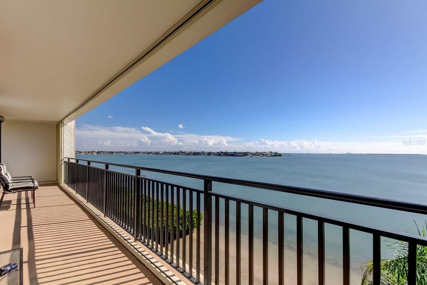 This is what dreams are made of! Elegant mid-rise waterfront condo on Boca Ciega Bay, offering a breathtaking 4th-floor water view that rarely comes available. The unit features a spacious floor plan with 1,425 square feet of heated living space, plus an additional 200 square feet of outdoor balcony space overlooking the stunning Boca Ciega Bay. You’ll never need a vacation when paradise is your primary residence! This split-floor plan condo features one expansive, continuous 40' x 5' balcony that spans the entire unit and is accessible from every room. This is where you’ll spend most of your time—enjoying morning coffee, reading your favorite book, and watching the sunlight dance across the water. I promise, this view will never get old! The split floor plan offers the privacy homeowners appreciate when hosting friends or family, while the 1,425 square feet of living space creates a warm, home-like atmosphere that many condos simply can’t match. Hurricane shutters span the entire porch for added peace of mind.  This building feels like a home, not a hotel—a true gem! Amenities include a small fitness room for residents, a community pool and spa, and designated under-building parking to protect your vehicle from the elements. This location places you just a short drive from all the destinations everyone loves—Clearwater Beach, Downtown St. Petersburg, Pass-A-Grille Beach, and Fort De Soto. This is more than just a condo—it’s an opportunity to own a piece of paradise! A rare find that offers the chance to put your own touch on it, with the sky truly being the limit!
