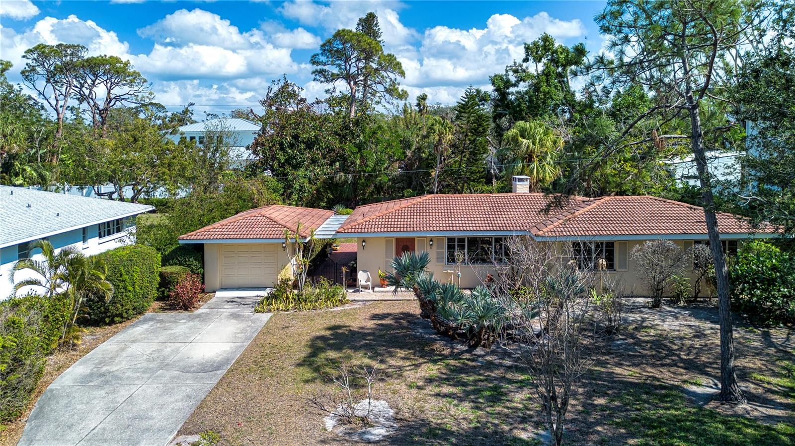 One or more photo(s) has been virtually staged. Welcome to Harbor Acres, one of the most beautiful and established communities in Sarasota! This charming, vintage Florida home and beautiful lot (15,000 sq. ft.) presents endless opportunities. Very few of these original 1950's Florida cottages remain! The integrity of the original design is still intact, including original floorplan and vintage baths. Outside, the gated courtyard extends from the front to the rear, opening onto an enchanting yard and pool, with mature landscaping and privacy. A large, screened lanai overlooking the pool and serene backyard offers the ideal private spot for relaxing and enjoying the beautiful setting. Perfect for the minimalist that treasures historic Florida and yet roomy enough for guests and entertaining. A.C. 2024. This home would be a true pleasure to restore!
Need something larger? Plenty of room to add on, or design and build your perfect dream home!
Harbor Acres is ideally located within a short stroll to the always lively Southside Village, including Morton's Market, a variety of wonderful restaurants and shopping. Minutes to downtown Sarasota, the bayfront, Sarasota Memorial, Selby Gardens and all of the Arts Sarasota is known for. St. Armands Circle, Lido and Siesta Key beaches are all within a 10 minute drive as well.
Don't miss this great opportunity!
Please note: Some water intrusion during Tropical Storm. Flooring has been replaced.