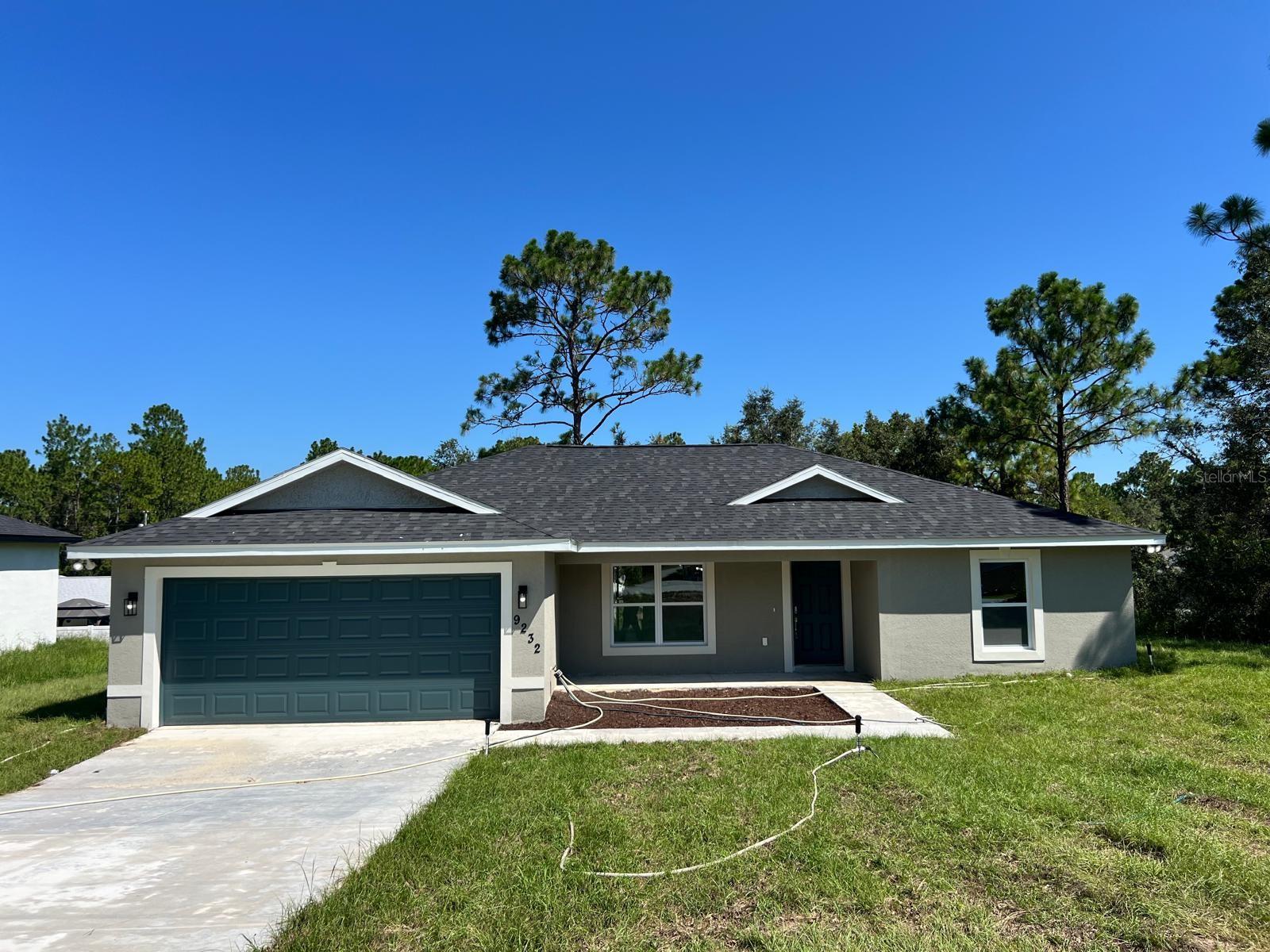 MOVE-IN READY NEW CONSTRUCTION in a highly valued and established neighborhood! This beautifully designed 3-bedroom, 2-bath home features a spacious open floor plan with luxury vinyl plank flooring, a modern kitchen with quartz countertops, stainless steel appliances, 42" cabinets, and a large island with breakfast bar. The split-bedroom layout offers a private primary suite with a walk-in closet and elegant ensuite bath with dual vanities and a tiled walk-in shower. Enjoy Florida living from the oversized covered lanai and charming front porch. Located on a great street surrounded by completed homes in a fully developed area—schedule your showing today!