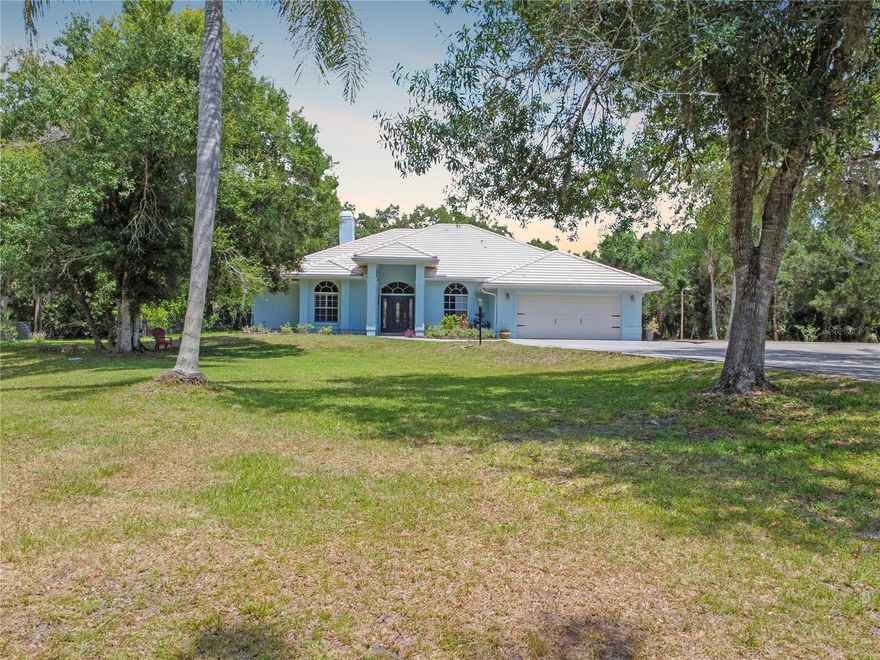 Country tranquility meets Sarasota convenience on this PRIVATE 5-ACRE estate tucked away at the end of a QUIET CUL-DE-SAC in the POPULAR GATED EQUESTRIAN COMMUNITY of Saddle Creek! This 4 BED + DEN/OFFICE, 3 BATH home with 2,510 square feet underwent a large renovation by Trinity Construction in 2018 (NEW KITCHEN, NEW FLOORING, NEW BATHROOMS, NEW PAINT, NEW LIGHTING & MORE). Inside, WOOD-LOOK PLANK TILE flows throughout the entire home, complemented by a WOOD BURNING FIREPLACE, 7 SLIDING GLASS DOORS OUT TO YOUR LANAI, and a TRAY CEILING in the spacious primary suite. The open farmhouse kitchen is both stylish and functional, featuring QUARTZ countertops, white RAISED PANEL CABINETRY, STAINLESS STEEL APPLIANCES, a WALK-IN PANTRY, and a generous 6 PERSON BREAKFAST BAR that creates a natural gathering space for family and guests. The primary suite serves as a relaxing retreat with a CUSTOM WALK-IN CLOSET and a SPA-INSPIRED BATHROOM showcasing DUAL VANITIES, a SOAKING TUB, a GLASS ENCLOSED SHOWER with beautiful tile work, and multiple shampoo niches for added convenience. Step outside to enjoy true Florida living with a HEATED POOL & SPA surrounded by a screened lanai, offering multiple areas for entertaining, dining, or simply relaxing while overlooking your private acreage. For those seeking a true equestrian or hobby farm lifestyle, the property is GATED, FULLY FENCED & CROSS-FENCED AND READY FOR HORSES, ANIMALS and TOYS! A well-equipped barn includes: TWO ~16x13 HORSE STALLS W/ WATER (room for 2 more), a 35x11 breezeway, THREE AIR CONDITIONED ROOMS (currently being used as a tack room/gym, music room & storage/workshop), and covered storage for lawn equipment and more. The grounds also feature THREE SEPARATELY FENCED/GATED PASTURES, STOCKED POND, 15x9 CHICKEN COOP, FRUIT TREES, REVERSE OSMOSIS SYSTEM, and even an RV HOOKUP, providing endless opportunities for recreation and self-sufficiency. The MATURE TREES create an unforgettable ambiance as you watch the SUNSETS outside your front door! The home was RE-PIPED in 2020 and the A/C was replaced in 2021! Saddle Creek is known for its horse-friendly environment and over 25 MILES OF RIDING TRAILS winding throughout the approximately 1,000-acre community of just 161 homes. Despite the PEACEFUL RURAL ATMOSPHERE, you are only 7 miles to Publix, 5 miles from I-75, 13 miles from Siesta Key Beach, about 15 miles from Downtown Sarasota and the UTC Mall, offering easy access to world-class beaches, dining, shopping, and cultural attractions. Set within the A-RATED RIVERVIEW HIGH, SARASOTA MIDDLE & LAKEVIEW ELEMENTARY SCHOOL DISTRICT! If you’ve been searching for the perfect balance of privacy, acreage, equestrian lifestyle, and proximity to Sarasota’s best amenities, this remarkable Saddle Creek property offers country living at its finest!