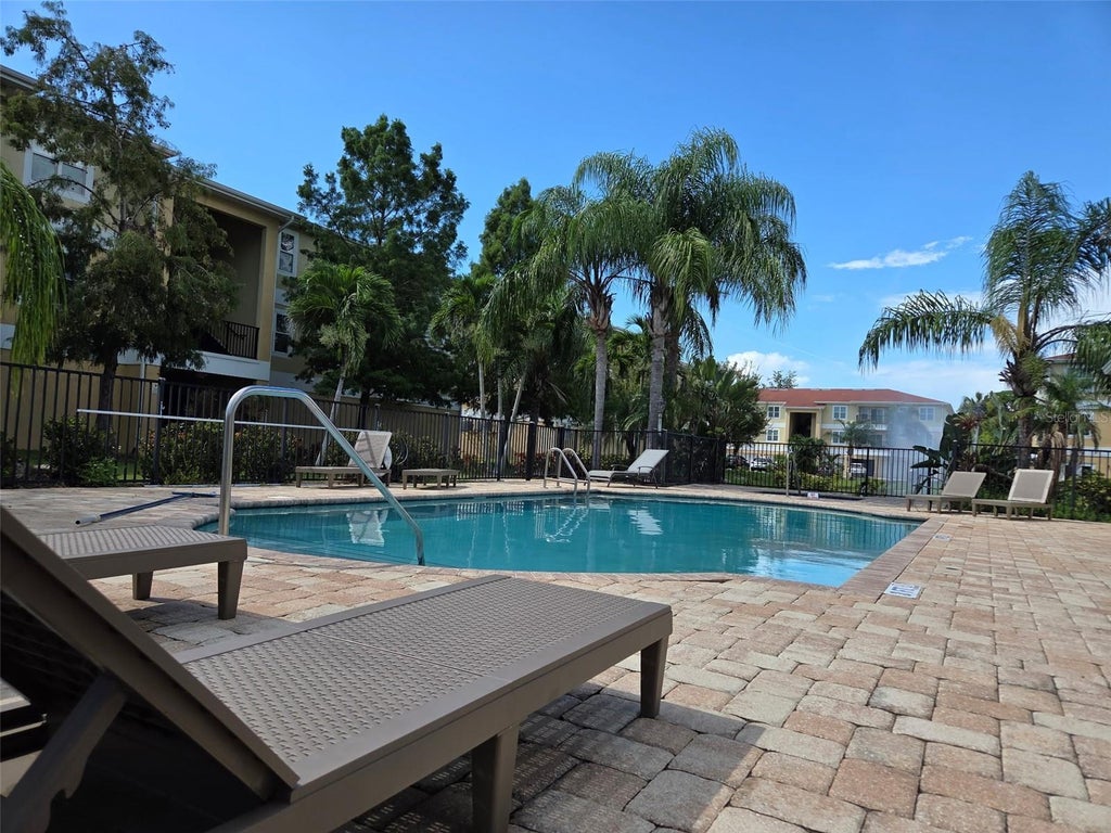 Photo of 5111 Royal Palms Way #202, New Port Richey, FL 34652 (MLS # TB8543915)