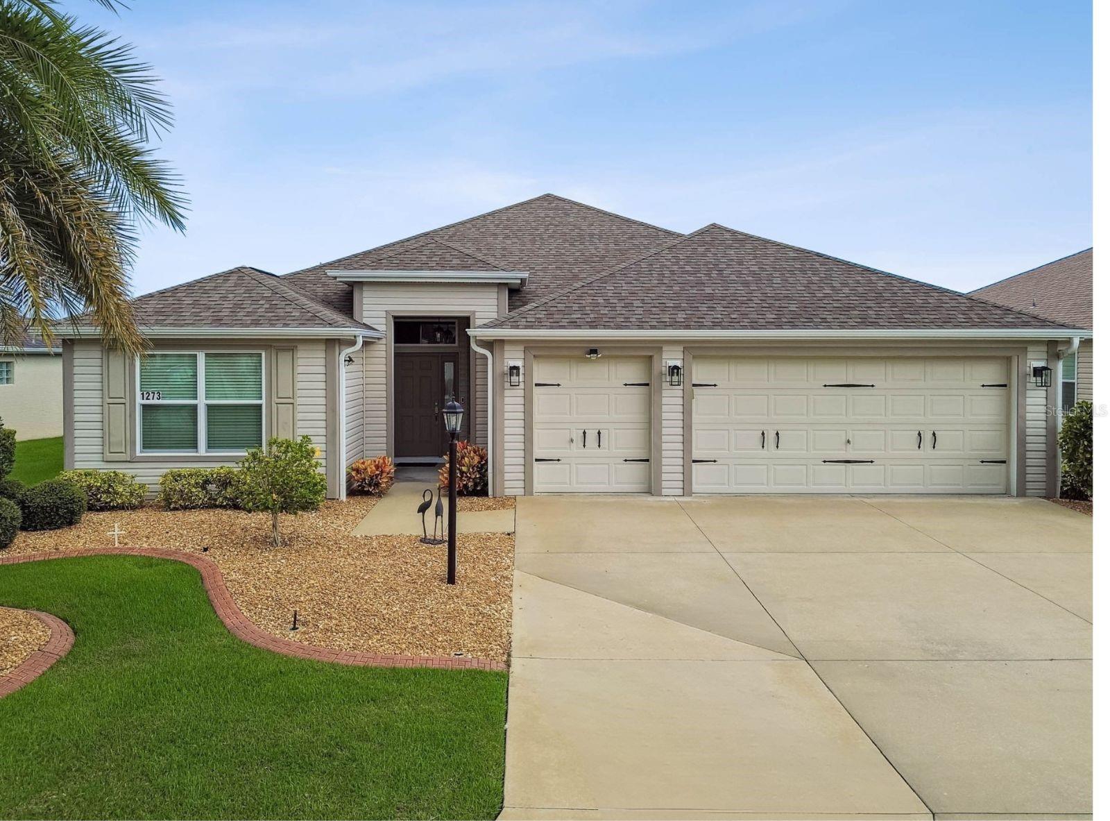 Beautifully maintained 3-bedroom, 2-bath Designer Home with a 2-car plus golf cart garage in the highly sought-after Village of Dunedin. Perfectly positioned between Lake Sumter Landing and Brownwood Paddock Square, you’ll enjoy shopping, dining, and entertainment just minutes away.
Curb appeal shines with an expanded driveway, rock beds, concrete curbing, gutters, mature upgraded landscaping, Zoysia sod, and a covered front entry. Inside, luxury vinyl flooring runs throughout with carpet only in the primary suite. The open floor plan extends into an enclosed and finished 28' x 9' temperature-controlled lanai—ideal for an office, exercise area, or den.
The kitchen offers a large breakfast bar, stainless steel appliances, a French door refrigerator with dual ice makers, pull-out shelving, and a bright breakfast nook. The spacious primary suite features a tray ceiling, his-and-hers walk-in closets, and an ensuite bath with dual vanities, a Roman-style shower with decorative tile, and a private water closet. A pocket door separates the guest wing for added privacy, with two guest bedrooms—one perfectly suited as an office or flex space. The guest bath includes a tub/shower combo and natural light.
The oversized garage has room for two cars, a golf cart (golf cart negotiable), a freezer, attic stairs, and generous storage. The laundry room is fully equipped with a wash sink and cabinetry. A stackable sliding door opens the living space into the lanai, and the split-bedroom plan enhances privacy for family and guests. An irrigation system keeps the lush landscaping thriving year-round.
This home can be sold furnished, or furnishings can be removed if preferred.
Close to Bradenton, Charlotte, Manatee, and Captiva Recreation Centers, Bonifay Golf & Country Club, Sarasota Golf Practice Range, and convenient shopping at Walmart Neighborhood Market and Publix, this home blends comfort, style, and a prime location.
Start living The Villages lifestyle today.