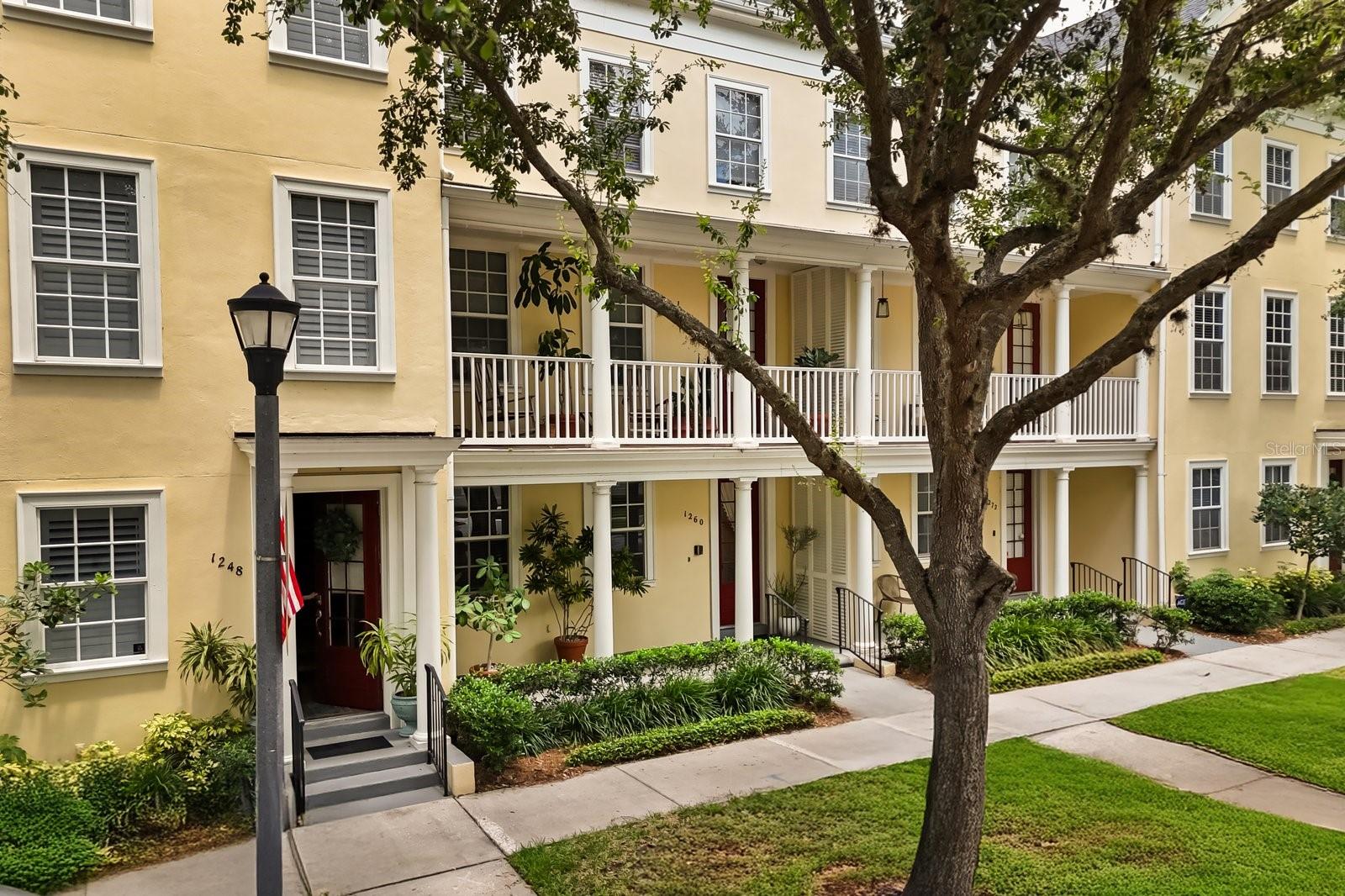 Live where you love- stylish Baldwin Park Townhouse featuring every upgrade available built by Rey Homes in 2004. The "Georgetown" floor plan features grand covered dual front porches that exude southern charm. Greet your visitors from a beautiful entryway with ceramic tile floors with easy access to rear facing garage accessible from the alley. Guests or family members wanting privacy can reside in the ground floor guest suite with large storage closet and private full bathroom. Graceful wood stair spindles and oak stair treads lead up to the second floor living area where friends and family can entertain, cook and relax together. West facing windows bathe large open kitchen in natural light with pantry space, sink in island, half bathroom that overlooks dining and living areas all with oak wood flooring. Large front facing balcony takes advantage of lively street views and cool breezes. Ascend the stairs to the third floor where primary suite with luxury awaits with walk in closet, dual bathroom sinks, separate tub and large walk-in shower awaits. Laundry closet conveniently located in hallway between bedrooms. Another spacious bedroom on the 3rd floor has ample storage closet and bathroom with shower en suite. Saving the best for last! This is one of a very few city townhouses with a large rooftop balcony to watch the colorful Florida sunsets. Roof replaced in 2024 and rooftop balcony completed redone with new tile deck. Upper floor could be used as a bedroom, game room or office with wet bar area, half bathroom, closets and additional storage under the dormers.
Don't miss this incredible opportunity to own of the most upgraded townhouses in Baldwin Park.