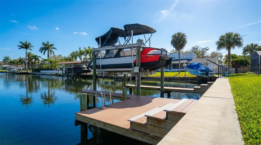 One or more photo(s) has been virtually staged. New Opportunity! Ready to build Land with a 88’ Waterfront Lot with Seawall, Lift & Plans in Place. 

Now offered at a new price, this Dana Shores waterfront homesite presents the opportunity to build without the typical upfront time, cost, and uncertainty of waterfront construction. A substantial portion of the due diligence has already been completed, allowing for a streamlined transition to the next owner.

This is not just a vacant lot — it’s a fully prepped, build-ready property with a direct canal waterfront setting that immediately stands apart.

Situated on an 88x114 homesite with 88 feet of saltwater canal frontage, the property offers direct, no-fixed-bridge access to Tampa Bay, wide canal exposure, and a straight water view with quick access to open water.

Beyond the physical improvements, extensive pre-construction work has been completed, including survey, geotechnical report, FAA review, and custom home design. Plans were previously approved for a large custom residence (approximately 6,000 sq ft of living space with an additional 3,000 sq ft lower level), providing clear insight into what the lot can support.

Major waterfront infrastructure is already complete. A new seawall (2023) and private boat lift (2022) are in place, along with dock electric and water connections — eliminating some of the most expensive and time-consuming elements of waterfront construction.

A custom home design done by Madison Homes is available for review and the builder is familiar with the property should a buyer wish to continue with the existing vision or adapt it to their own design.

Highlights:
• 88 feet of saltwater canal frontage
• Direct Tampa Bay access with no fixed bridges
• Cleared and build-ready 10,032 sq ft homesite (88x114)
• New seawall (2023) with 53 linear feet, 24" cap, tiebacks, drainage, and 10’ returns
• Backyard elevation raised approximately 36"
• New 10,000 lb aluminum boat lift (Lift USA) with upgraded components
• New pilings with high-density poly wrap for protection
• Dock equipped with electric and water supply
• RSC-6 zoning for elevated coastal construction
• No HOA

Pre-Construction Work Completed:
• Demo: $26,000
• Survey: $1,200
• Geotechnical report: $1,800
• FAA review: $100
• Custom home design plans (Madison Homes): $60,000

A meaningful portion of the early-stage due diligence — often the most uncertain and time-intensive phase of building — has already been addressed, allowing a buyer to move forward with clarity and momentum.

Positioned at the end of a quiet canal with Rocky Point Golf Course across the street, the setting offers water views behind and open green space in front — a rare combination in an established waterfront neighborhood.

Dana Shores provides a peaceful residential setting while remaining minutes from Tampa International Airport, Downtown Tampa, Hyde Park, International Plaza, professional sports venues, state parks, and Gulf beaches. From your backyard, enjoy direct boating access to Tampa Bay and beyond.

Start building your new waterfront home this year.  Whether designing a custom waterfront residence or you are a builder seeking a de-risked project in a proven location, this property represents a compelling opportunity with significant groundwork already complete.

Survey, plans, and supporting documentation available upon request.