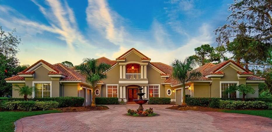 **RENTAL OPPORTUNITY (unfurnished)** SPACIOUS, LUXURIOUS and BEAUTIFULLY RENOVATED, GOLF COURSE ESTATE situated behind the SECURE GATES of The Oaks Country Club Community, Boasting OVER 9,000sf and located on a prominent, private cul de sac lot of Over 3/4 Acres. Expansive room abounds in this LIGHT and BRIGHT Open Floorplan consisting of 4 Beds + 4/2 Baths + Office/Library + Home Theater + Game Room w/ Wet Bar, Loft, Balcony, etc. and even includes highly coveted, oversized and split 4-Car Garage(s). This MOVE-IN READY home has been tastefully updated and is ideal for indoor and outdoor entertaining! The elegant first level primary bedroom suite features high ceilings, multiple walk-in closets, garden tub, large custom walk-in shower and an adjacent nursery/fitness/den area. The sprawling, gourmet kitchen entails a generous island and counter seating area, premium stainless steel appliances, granite counters, solid wood cabinets, walk-in pantry and more. The upstairs loft leads to two vast bedroom suites, theater room and screened terrace/balcony. Enjoy the utmost in Florida outdoor living with a Heated Pool & Spa with Fire features and a large screened lanai with Outdoor Kitchen and seating areas while overlooking the serene interior, Heron Golf Course. THE OAKS is a distinguished country club community which boasts many accolades including: Platinum Club of America, Emerald Club of the World and Elite Distinguished Club of the World. The Oaks is just minutes from nationally ranked Pine View School, the Legacy Bike Trail, area Beaches and all that Gulf Coast living has to offer. **MUST SEE**
