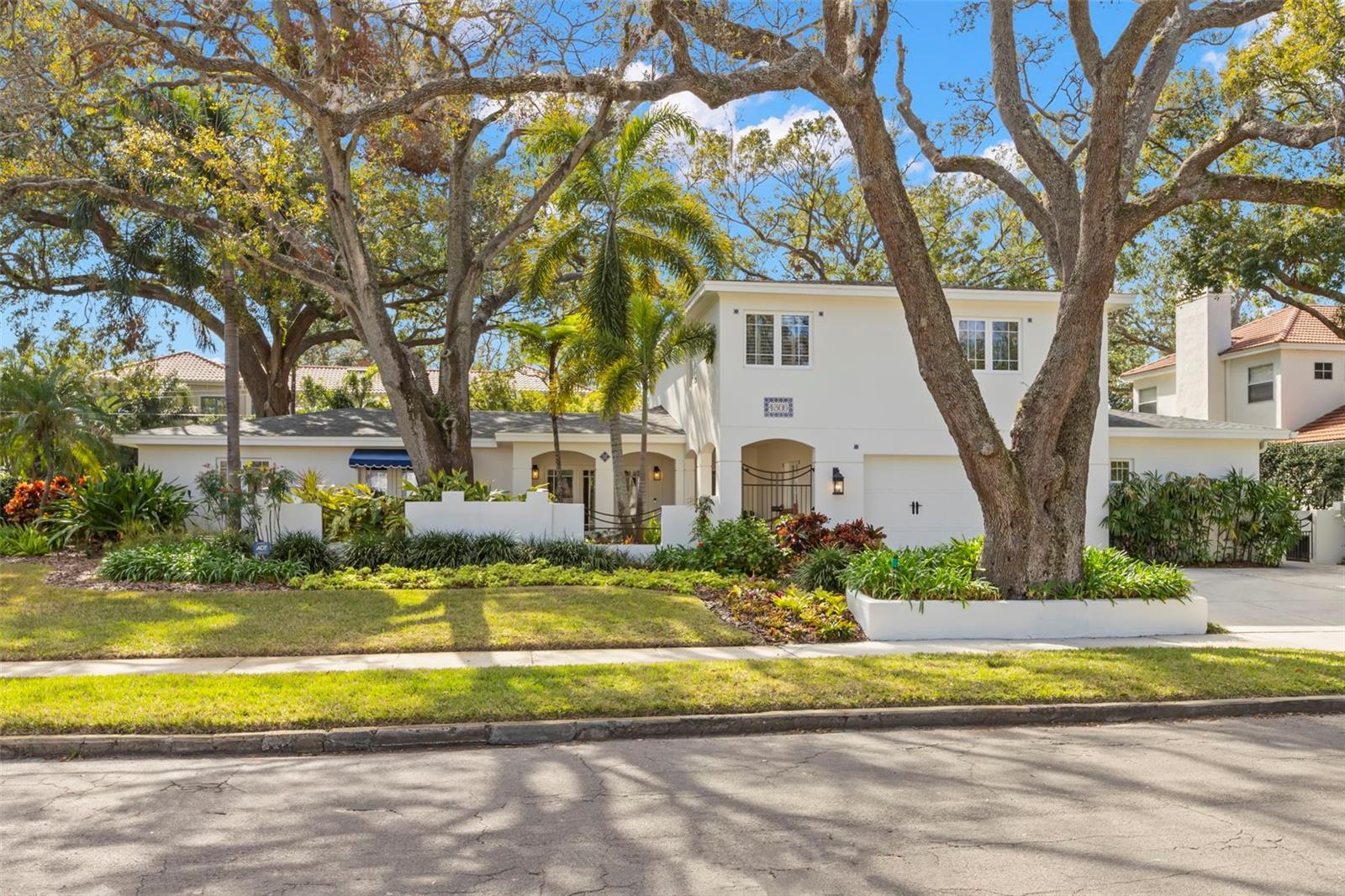 Welcome to the coveted neighborhood of Beach Park! This Spanish Mediterranean pool home is situated on a fabulous 111x141 size lot steps away from Swann Circle Park. This home has been impeccably maintained and features stunning arches and finishes throughout. The entry foyer welcomes into the home flanked by the formal living room & dining room. Enjoy relaxing in the oversized great room that is separated by a double sided fireplace and built-ins. The great room opens up to the chef's kitchen with beautiful Italian terracotta basketweave tile floor and features loads of cabinetry that has been freshly painted with new hardware, stainless steel appliances, double ovens, center island with a prep sink, a large walk-in pantry and banquette seating for casual dining. This floor plan is incredibly versatile with 2 bedrooms downstairs that share a hall bathroom plus an entire guest wing with a living area, bedroom & full bath that could easily be converted into a downstairs primary suite. A laundry room with a secondary refrigerator and full bathroom that doubles as a pool bath completes the first floor. Upstairs you will find a loft, an office with a closet and a large primary suite with an attached bonus room/sitting room. The primary suite has dual walk-in closets, double vanities & a walk-in shower. The backyard is a dream with a pool and plenty of green space for all sorts of outdoor activities. No flooding in either storm. Minutes to Hyde Park, Soho, Downtown, TIA, International Mall, wonderful restaurants, shopping and the Gulf beaches.