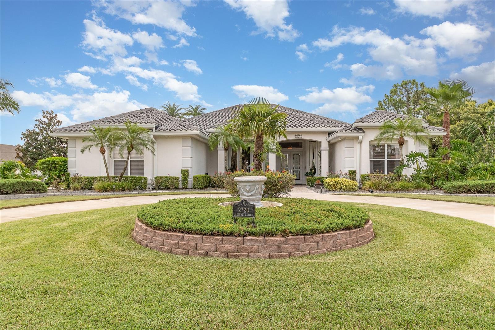 Nestled within the guard-gated Spruce Creek Fly-In community, this elegant residence features expansive windows, high ceilings, and beautiful architectural details. The thoughtfully designed floor plan offers comfort and versatility for any lifestyle with generous entertaining spaces, along with a split layout for the four bedrooms and three full bathrooms. The eat-in kitchen, complete with a center island, granite countertops, stainless steel appliances, plentiful cabinetry, a walk-in pantry and a casual dining nook overlooking the pool, flows effortlessly into the inviting family room. Triple-sliding doors link the indoor area to the outdoor living space. The primary suite offers direct access to the pool and patio, and its ensuite bath is nicely appointed including a dual vanity and a walk-in shower, complemented by a walk-in closet. Notable highlights include a new 2023 tile roof, a sizable covered outdoor living area, a lanai complete with a pool and spa, and a side-entry three-car garage. A circular driveway and lush landscaping add to the home’s appeal as does its location within the Four Seasons area of Spruce Creek Fly-In. The quality of life found in this community is unmatched. The streets are golf-cart friendly; the gate is staffed 24/7, and there is security patrol and on-site management. Residents benefit from a variety of amenities and activities, including a playground, parks and the Spruce Creek waterway, which is perfect for fishing or launching a canoe or kayak. The community has a public restaurant, a hair salon, a massage therapist, and various business services. Optional country club memberships provide additional benefits such as golf, tennis, pickleball, fitness, and access to a private restaurant. The community features a private 4,000-foot paved runway for resident’s use, equipped with GPS approach, paved taxiways, and aviation services. The community’s location is ideal, providing easy access to local shopping, dining, entertainment, beaches, and water sports. Just minutes from Embry Riddle Aeronautical University, NASCAR headquarters, and major highways I-4 and I-95, this residence is less than an hour’s drive from Orlando. This represents a rare opportunity to purchase a beautiful home in one of Central Florida’s most desirable communities.