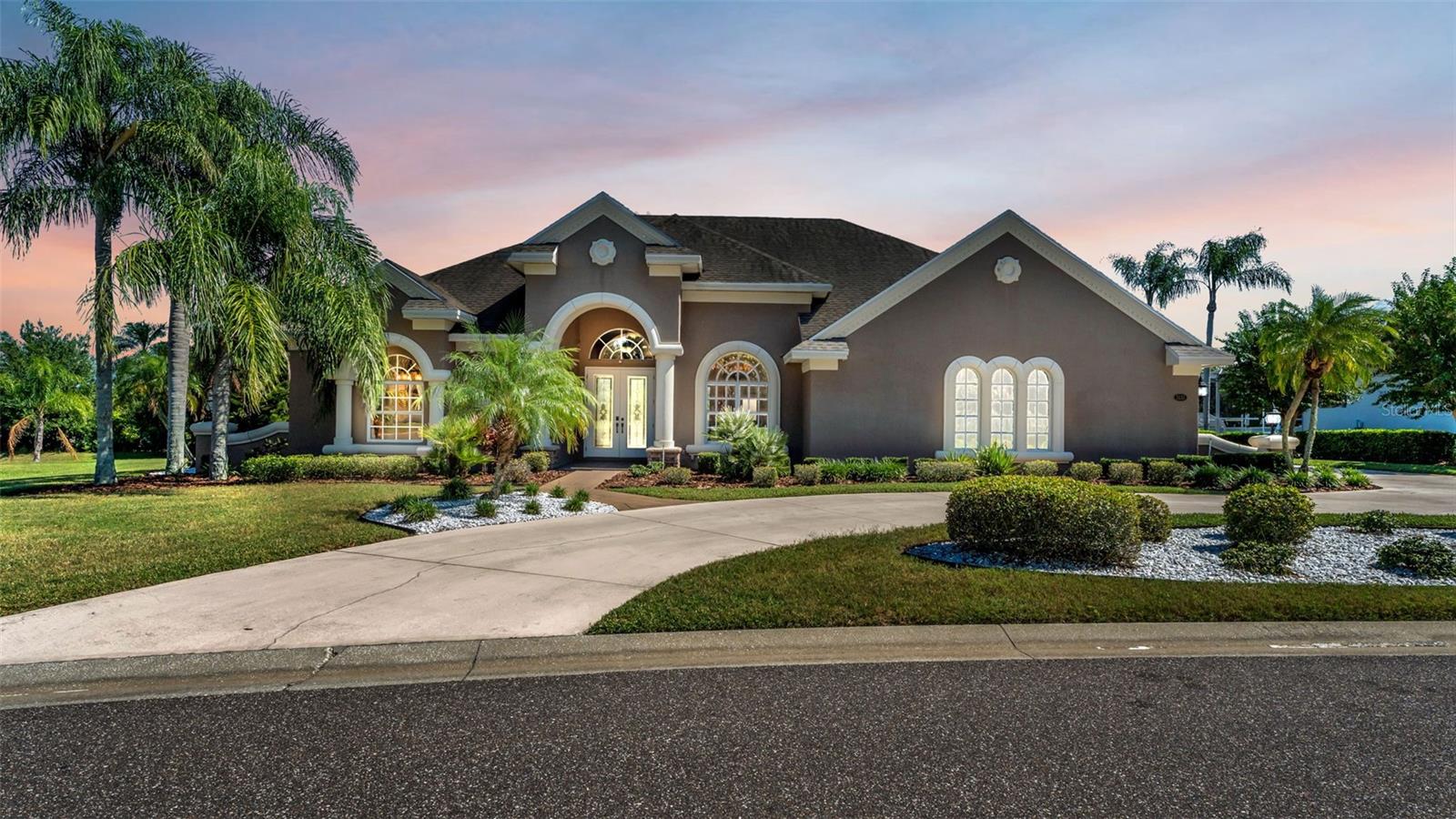 Luxury and comfort blend seamlessly in this beautifully upgraded home designed for effortless living and entertaining. The triple split floor plan offers spacious, light-filled rooms and a gourmet kitchen with an expansive work island, designer lighting, and a custom walk-in pantry that’s every homeowner’s dream.
An inviting den/playroom adjoins the family room, while pocket sliding glass doors create a seamless flow from the indoor living area to the screened saltwater pool and patio—perfect for year-round gatherings. The primary suite features an upgraded bathroom with new quartz vanities, mirrors, and light fixtures, adding a fresh, modern touch.
Additional highlights include interior paint completed in 2025, EV charging setup, several stylish accent walls, updated lighting, a side-entry garage, and a circular driveway offering ample parking. The backyard is beautifully landscaped and partially fenced with PVC fencing for privacy.
Located in the gated community of Highlands by the Lake, residents enjoy access to a clubhouse, tennis courts, and pool. This home exemplifies luxury Florida living at its finest.