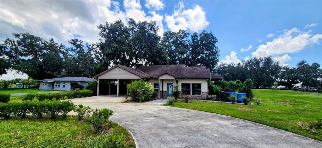 Photo of 1205 E Knights Griffin Road, Plant City, FL 33565 (MLS # L4956525)