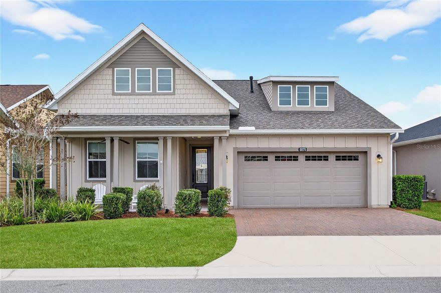 Looking to slow down and start enjoying life? Look no further than this beautifully appointed two-bedroom, two-bath home in the sought-after Ocala Preserve community! This home has a versatile den, thoughtfully designed with both style and functionality in mind and a custom Master closet that will be the envy of friends. The open-concept lets the cook in the family engage with guests while entertaining. Crown molding throughout and stunning tile flooring create a cohesive, elegant feel, while plantation shutters and upgraded ceiling fans add timeless charm. The home is equipped with SMART features allowing you to remotely monitor internet-connected devices such as lights, thermostats, locks and appliances increasing efficiency and security. Under-cabinet lighting enhances both ambiance and convenience. The kitchen and living spaces flow seamlessly, allowing the cook in the family to engage with guests. The den, kitchen, living room, primary bedroom, and lanai are all wired for speakers—perfect for entertaining or relaxing at home. Step outside to enjoy the fully fenced backyard featuring attractive hardscaping, a gas firepit, and tranquil views overlooking a walking trail and retention pond. Appreciate nature’s beauty as you sit back and enjoy the breathtaking sunsets. Additional highlights include a 30-amp car charger, a non-electric water softener, and a welcoming front porch with ample space for Adirondack chairs—ideal for morning coffee or evening relaxation. This home combines modern upgrades with inviting outdoor spaces, offering comfort, efficiency, and exceptional curb appeal. This home was designed for making memories that will last a lifetime! Schedule your private tour today.