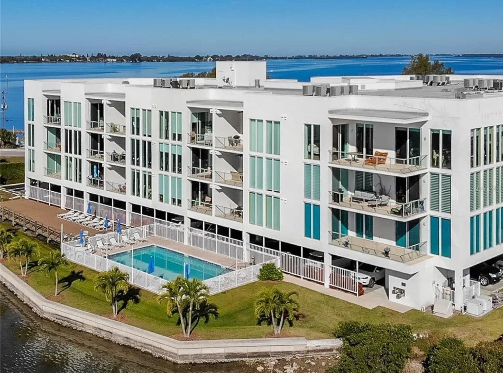 SUMMER AND FALL OF 2025, NEW VACATION RENTAL RATE of $2999.00! BEAUTIFUL WATER FRONT CONDO WITH BOAT DOCK AND LIFT!
Wake up each morning surrounded by the serene beauty of Lemon Bay. This stunning, high-end condo in the "Red Fish" building offers a luxurious and tranquil living experience. Enjoy your mornings with a cup of coffee on one of the two open balcony porches as the warm water breeze softly touches your skin.
The unit is incredibly open and spacious, offering ample room for relaxation and entertainment. With a waterfront pool, you can take a refreshing dip while enjoying the picturesque views. The condo's prime location allows you to walk to the nearby beach, great restaurants, shopping centers, and everything else you could desire for a comfortable and fulfilling lifestyle.
For those with a passion for boating, this condo comes with a boat dock and lift, providing convenient access to the bay. Please note that annual rentals require the first month's rent, last month's rent, and a security deposit.
Unfortunately, this condo building does not allow pets.