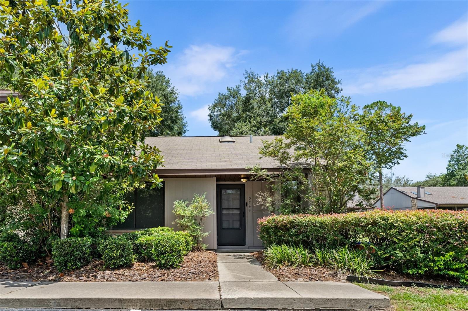 Beautiful Corner unit in Mile Run! Welcome to the perfect blend of comfort, space, and convenience in this well-maintained 2-bedroom, 2-bath home. Located in a desirable community , this home features an open floor plan with soaring vaulted ceilings, abundant natural light from skylights, and gorgeous laminate flooring throughout. The spacious great room boasts a cozy fireplace and French doors that open to a large enclosed three-season sunroom with glass windows and screens, ideal for relaxing or entertaining year-round. The sunroom also includes a dedicated storage space and a full laundry room. Enjoy a brand new A/C unit (installed July 2025) and a tile-floored kitchen with plenty of storage. Residents of Mile Run enjoy access to a fantastic community clubhouse, pool, tennis courts, racquetball court, and playground. Just a 10-minute drive to UF, Shands, the VA Hospital, and Santa Fe College, this home offers the lifestyle and location you’ve been looking for! Don't miss your chance to make it yours!