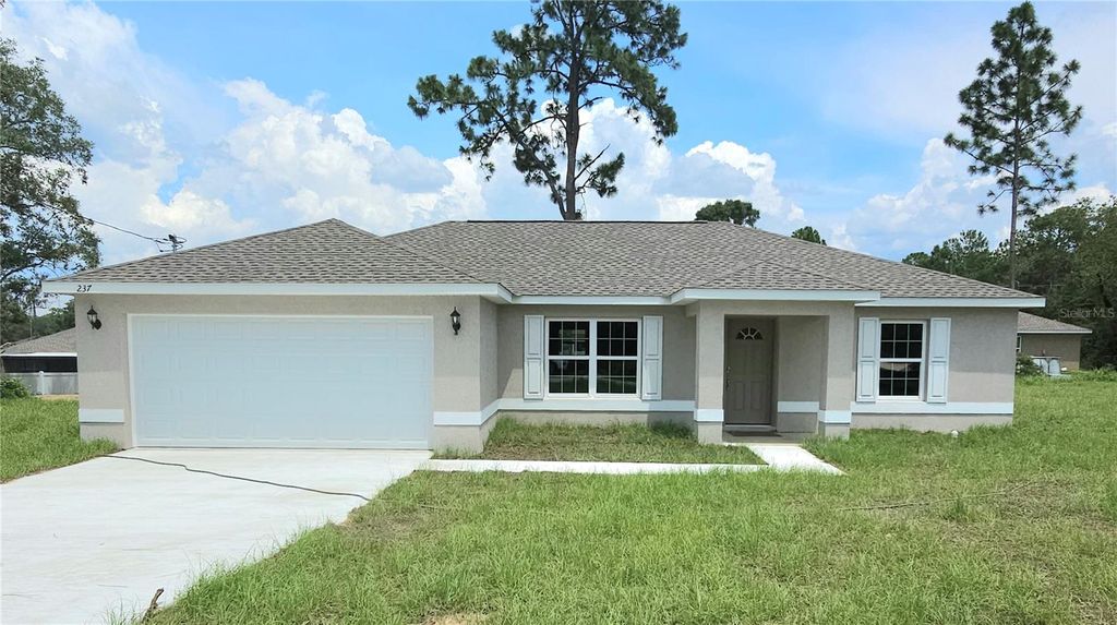 Photo of 237 Locust Pass Drive, Ocala, FL 34472 (MLS # OM722156)