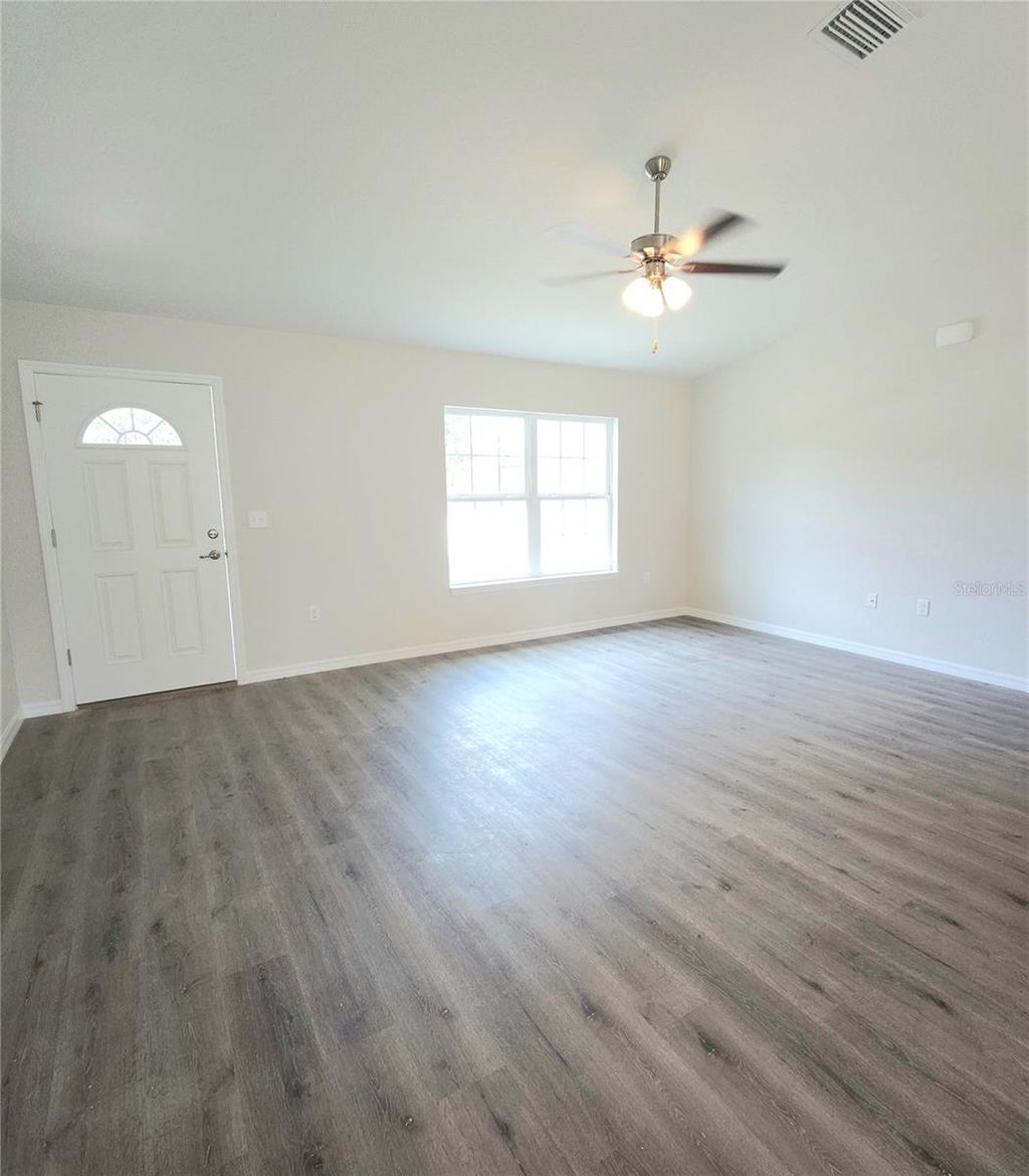 Photo of 237 Locust Pass Drive, Ocala, FL 34472 (MLS # OM722156)