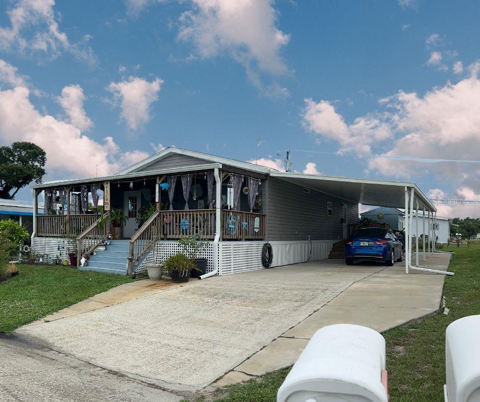 Welcome to your bright and cheerful new home in the sought-after Sebring Falls, a welcoming 55+ community where you own the land—no lot rent! This immaculately maintained 2018 Mobile Home is in new condition with 3 bedrooms, 2 bathrooms, offering the perfect combination of comfort, convenience, and Florida charm. Situated on a spacious 100’ x 56’ lot, this 2,108 sq. ft. home features a wrap-around porch and a second side porch, ideal for relaxing with morning coffee or entertaining guests. The oversized carport provides shelter for your vehicle, while the extended driveway offers ample parking for visitors. You’ll also enjoy outside storage space and hurricane shutters for added peace of mind. Inside, the home is showered with natural light and boasts a bright, open layout perfect for both everyday living and hosting. With three full bathrooms, there's plenty of room for comfort and privacy for both residents and guests. The low $40/month HOA fee includes access to the community clubhouse and heated pool, making it easy to enjoy the Florida lifestyle year-round. Need extra space for your boat or camper? Extra storage is available for just $10 Flat Fee. Conveniently located close to shopping and offering an easy commute to both Tampa and Orlando, this home is the perfect blend of tranquility and accessibility. Don’t miss your chance to own this gem in Sebring Falls—schedule your private tour today!