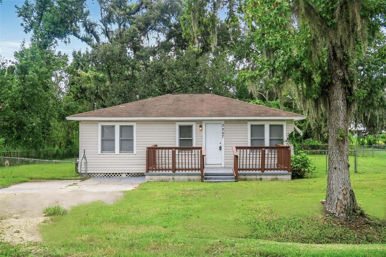 One or more photo(s) has been virtually staged. Welcome to 3207 E Trapnell Rd in Plant City! This charming 3-bedroom, 1-bathroom home sits on over an acre of land, offering plenty of space and privacy. A cozy front porch and a spacious back patio provide the perfect spots to relax and take in the land. Inside, you'll find a recently updated interior with fresh paint throughout. The kitchen comes equipped with a range, oven, and refrigerator. The large fenced yard is ideal for outdoor activities and pets, and a storage shed adds extra convenience. Located near Springhead Park and within minutes of Springhead Elementary, this home has the comfort of country living with easy access to local amenities.
Call Palm Island Realty today to schedule a showing!
Some photos in this listing have been virtually staged to help illustrate the property’s potential. No physical changes have been made to the property.
As part of this month's move-in special, the $350 non-refundable cleaning fee is waived! Prospective tenants are subject to a $75 application fee /applicant and a $150 administrative fee. There is also a $17 monthly asset protection fee. If applicable, pets require a $300 non-refundable fee /pet. Sign a lease this month to take advantage of these limited-time savings!