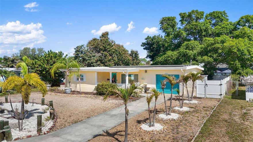 Welcome to this beautifully maintained concrete block home offering a true tropical feel in one of St. Petersburg’s most desirable neighborhoods! Ideally located near the Tyrone area with easy access to beaches, shopping, dining, and vibrant downtown St. Petersburg.
This spacious 3-bedroom, 2-bath home features a highly sought-after split bedroom floor plan and an abundance of living space. Vaulted ceilings create an open, airy feel throughout the main living areas, while the large living room flows seamlessly into the dining space and modern, open kitchen—perfect for everyday living and entertaining.
The kitchen has been recently updated with white shaker cabinets with crown molding, stainless steel appliances, a large pantry, and modern tile flooring.
The split bedroom layout offers a primary suite with an updated en-suite bath on one side of the home, while two generous guest bedrooms are located on the opposite side and share a fully renovated hall bathroom featuring a new shower, vanity, glass shower doors, and stylish wood-look tile flooring.
Step outside and enjoy Florida living at its finest with a large covered and screened front porch, a massive rear screened patio, and an additional open-air patio overlooking the fully fenced backyard. The yard features low-maintenance turf grass, a white vinyl privacy fence, and a spacious 12x12 storage shed—perfect for tools, bikes, and beach gear!
Additional highlights include deep step-in closets, a circular driveway for ample parking, an indoor laundry/utility room with additional storage space, and a bonus room at the rear of the home offering flexible space for a home office, playroom, or den. For those who appreciate mid-century charm, terrazzo flooring lies beneath the laminate, ready to be uncovered.
Fantastic layout, high ceilings, lovely updates, plenty of parking, and a backyard made for entertaining—all in a fabulous central location… this is THE ONE you’ve been waiting for! Don’t wait—schedule your private showing today!