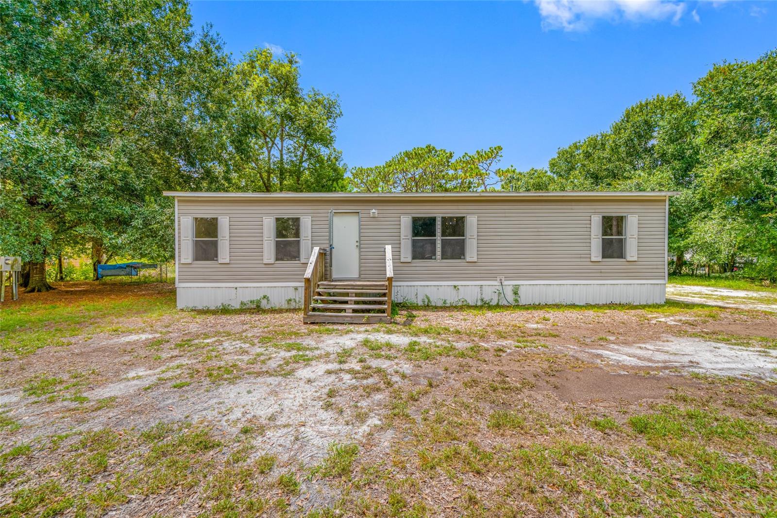 **Multiple Offers received - Highest and Best due by Tuesday 8/19 @ 5pm** While the property is being sold for the value of the land, it includes a 2007 three-bedroom, two-bath mobile home and outbuildings—all being sold as-is and priced to sell quickly. Sitting on a full acre you own, in a non-flood zone, this move-in-ready home features a primary suite with a walk-in closet, inside laundry, and a storage shed, or you can update the cosmetics for a more modern look. Enjoy the space and flexibility of country-style living while staying close to parks, lakes, shopping, dining, and entertainment. Opportunities like this don’t last—schedule your showing today! Seller will not consider wholesale offers, assignable contracts, or offers subject to assignment. All offers must be submitted with the buyer named and intended for a direct purchase.