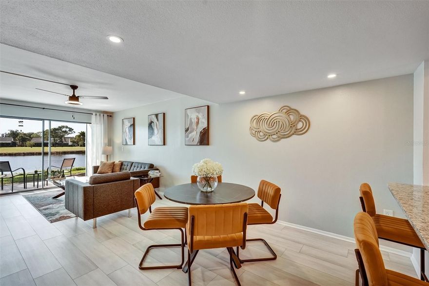 Welcome to the Meadows. This 1 bedroom, ground floor unit sits among mature oaks with beautiful lake and golf course views. This spacious, light-filled condo features an open floor plan and a nice size kitchen with granite countertops, a breakfast bar, stainless steel appliances, sparkling glass mosaic tile backsplash and a large bedroom with a walk-in closet. Watch the sunset over the lake from your covered patio. Your own Laundry closet prevents you from having to go to the laundromat. Plus, if you ever feel the need to get out and "go do something" you won't have to go far, as you'll be surrounded by golfing, near shopping, dining and more at The Meadows Village, The Mall at University Town Center and University Parkway and just a short drive to I-75, restaurants, parks, entertainment, recreation, museums, downtown Sarasota and beautiful gulf beaches. Opportunity to own in beautiful community with low HOA Fees. THIS is the Sarasota lifestyle.