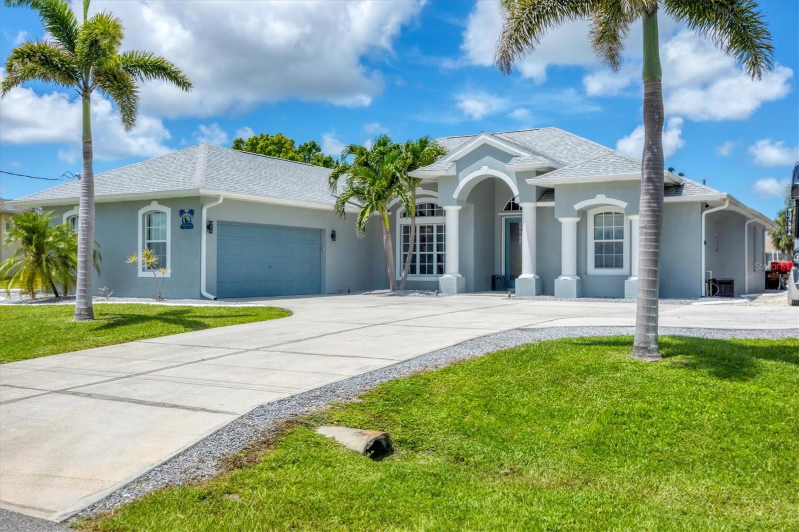 **STUNNING WATERFRONT OASIS with SALTWATER HEATED POOL and DOCK with LIFT**
Welcome to your Florida dream home in the waterfront boating community of South Gulf Cove. This beautifully appointed 3-bedroom, 3-bath residence sits on an oversized lot and offers 2,483 sq ft of open, light-filled living space with breathtaking views of intersecting canals.
Enter through elegant double glass entry doors into a spacious, split floor plan featuring a tray-ceiling Great Room, diagonal tile throughout, and seamless flow between the kitchen, family room, Great room, and dining area — all centered around panoramic views of the saltwater heated pool and canal beyond.
Gourmet kitchen with granite counters, stone backsplash, breakfast bar, and abundant storage. Primary suite with tray ceiling, lanai access, walk-in closet, and a spa-like en-suite with dual vanities, whirlpool tub, and walk-in tiled shower with bench. Two guest bedrooms (one with a walk-in closet) and well-appointed guest bath with granite vanity and tiled tub/shower combo. Full pool bath with walk-in tiled shower for rinsing off after a swim or day on the water. Flexible space ideal for a home office or formal dining.Laundry room with utility sink and cabinetry. Ceiling fans, window treatments, and storage throughout 8' interior doors. Saltwater heated pool under a screened lanai with roll-down sun/privacy screens. Private dock with 10,000 lb boat lift, water and electric hookups — ideal for cleaning up after a boat day or relaxing by the water. Side-entry, oversized 2-car garage with epoxy flooring, workbench, and screen enclosure. Extended driveway with RV/boat pad and 50-amp hookup (2024), New roof (2023) and new front door (2023). Hurricane-rated shed for additional storage
This sought after community, South Gulf Cove, is a waterfront community with voluntary HOA, residents on the water enjoy access to the
Myakka River, Charlotte Harbor, ICW, and Gulf of Mexico. As wellas day trips to Fisherman's Village or Cabbage Key. A nice boat ride out to Boca Grande to enjoy the beaches, sandbars, resturuants and more! A community boat ramp, parks, walking trails, and bike paths Close proximity to the pristine beaches of Boca Grande and a short drive to Manasota Key, with its charming shops, dining, and laid-back beach vibes
This home delivers Florida lifestyle at its finest — whether you're a boater, beach lover, entertainer, or simply looking for serenity by the water. Book your appointment now and Live in Paradise!!!