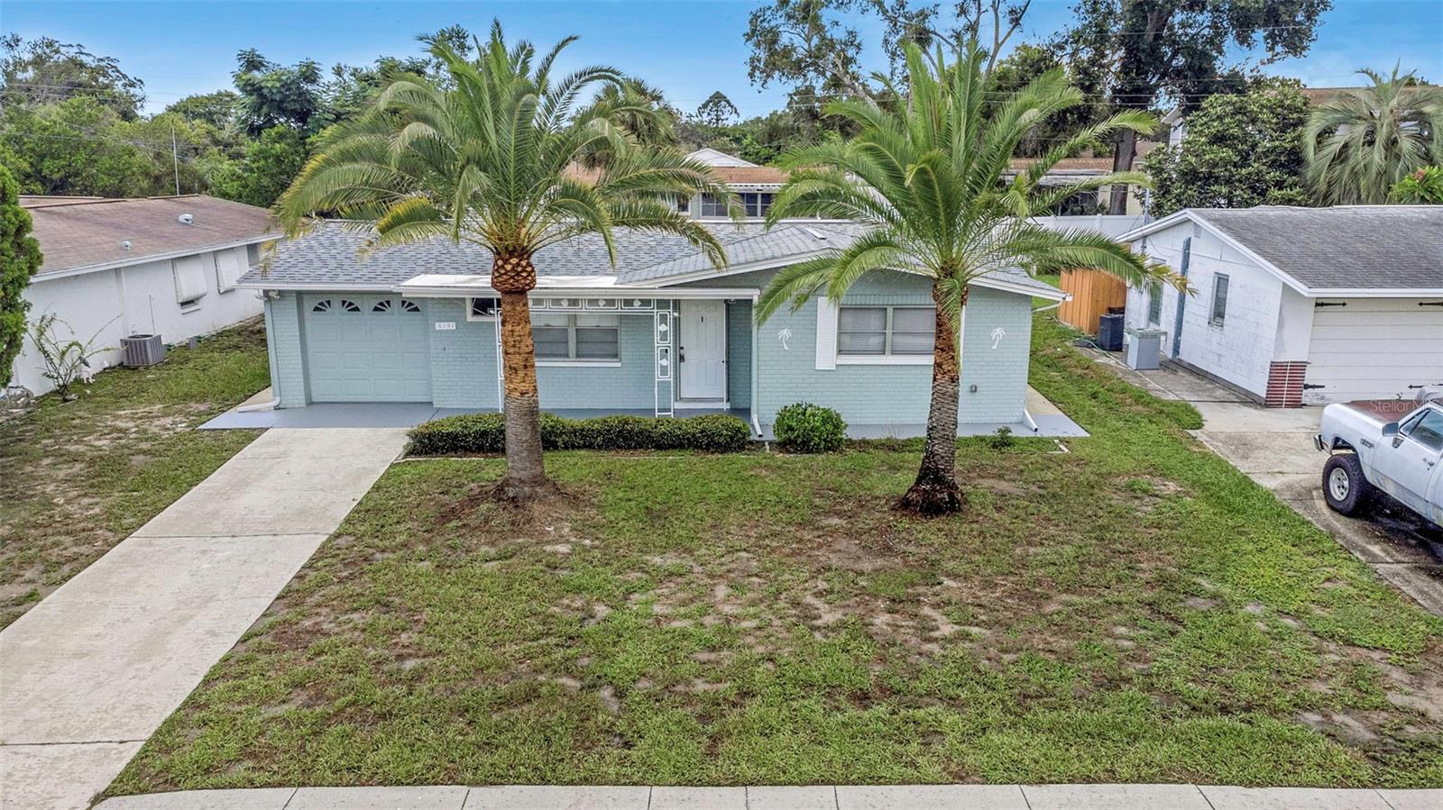 Located in the beautiful, historic downtown community of New Port Richey is this 2-bedroom, 1-bathroom, 1-car garage home. Covered front porch and a screened rear patio perfect for relaxing or entertaining. Roof (2019) Ac system (2016), Electrical (2022), Kitchen (2025), Appliances (2025) LVF plank flooring throughout most of the home (2025)., No flood insurance required, and property was not affected by past storms. You are walking distance or a short golf cart ride away from Sims Park/amphitheater, multiple bars, breweries, restaurants, health food market and shops. Being a part of the golf cart friendly downtown community means you’re right in the heart of events, parades, concerts and festivals offered year-round. You will also have access to the public library, recreation center with aquatic pools and slides, tennis and basketball courts, and fitness center, as well as a public boat ramp just down the street to launch your boat, paddle boards or kayaks. Don't wait, this kind of opportunity does not come on the market very often. Become a part of our community today!