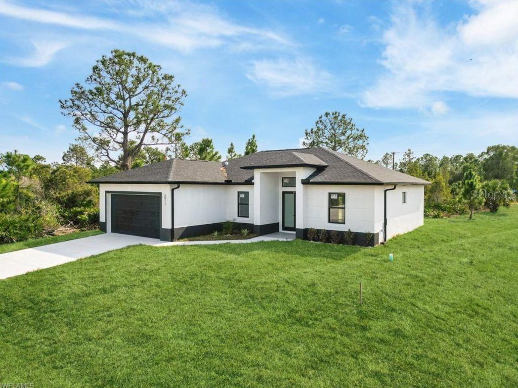 ""Corner lot"", Welcome to this exquisite 3-bedroom + den, 2-bathroom home, featuring 1,630 sq ft of thoughtfully designed living space. From the moment you step inside, you'll be captivated by the attention to detail and high-end finishes throughout. The sleek porcelain tile flooring and impact-resistant windows and doors offer both style and peace of mind. The open-concept layout is enhanced by soaring double-height ceilings, creating an inviting and expansive atmosphere. The chef-inspired kitchen showcases stunning quartz countertops and top-tier finishes, perfect for culinary enthusiasts and entertainers alike. The luxurious master suite provides a serene escape, complete with a spa-like en-suite bathroom featuring a walk-in shower and dual vanities for added comfort and convenience. Set in a quiet, desirable neighborhood, this home offers easy access to major roads like Gunnery Rd, Sunshine Blvd, and Lee Blvd, putting shopping, dining, and local amenities just minutes away—without sacrificing tranquility. A perfect combination of style, comfort, and convenience awaits. Don’t miss your chance to see this beautiful home in person—schedule your private showing today! Pictures are from the same model but in different location