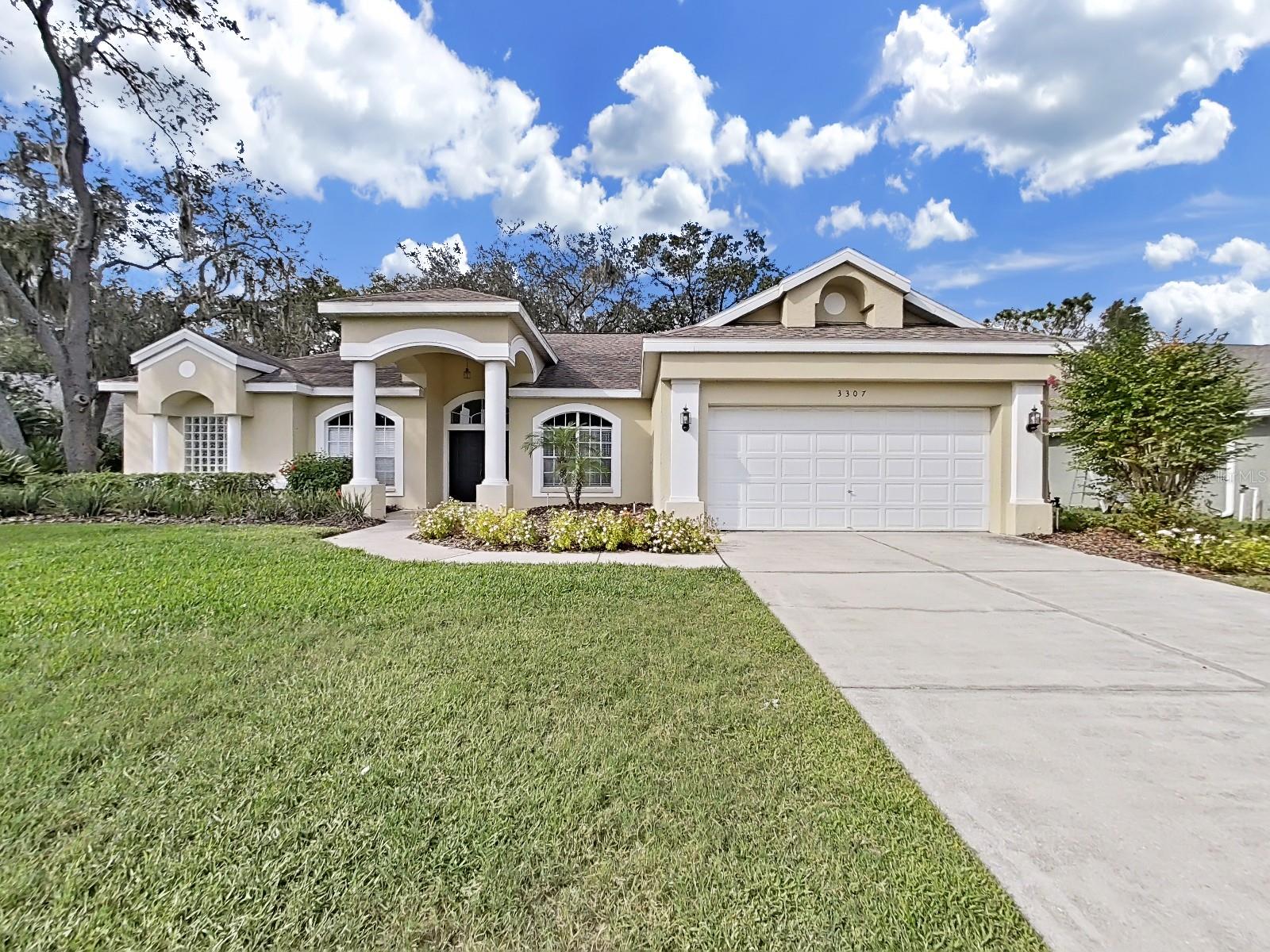 Available November move in. Located in the desirable Walden Lake neighborhood of Plant City, this pristine 4-bedroom, 2-bathrooms, 2 car garage home offers a blend of comfort and modern style. No Carpet. The property features attractive curb appeal, a serene setting, and a welcoming family room with large double doors. It boasts a open floor plan with wood-look tile flooring, a spacious kitchen with shaker cabinets, and ample counter space. The four spacious bedrooms provide comfortable private retreats, including a primary bedroom with a luxurious ensuite bathroom. The lanai overlooks a wooded backyard, ideal for relaxation. Residents enjoy community amenities like parks, trails, a lake, and a sports complex. Lawn care is included in the rent.
