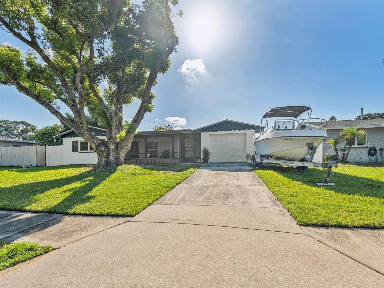 Welcome to 9951 53rd Ln N, Pinellas Park, FL 33782 – A Fully Renovated Florida Gem. Discover this beautifully reimagined 2-bedroom, 1-bathroom home offering 1,048 square feet of modern living in the heart of Pinellas Park. Fully renovated from top to bottom, this property blends functionality with elevated style. Step into a bright, open-concept kitchen featuring brand-new cabinetry, stainless steel appliances, and premium finishes, perfect for both everyday living and entertaining. The home showcases fresh interior paint, new lighting, and plush carpeting in the bedrooms, complemented by polished ceramic tile flooring throughout the main living areas. The oversized, spa-style walk-in shower adds a luxurious touch to the fully updated bathroom, while an indoor laundry room provides added convenience. Additional upgrades include central air, electric heat, recessed lighting, custom closets, and a one-car attached garage. Outside, enjoy a fully fenced backyard oasis—ideal for relaxing, entertaining, or customizing with a garden, firepit, or future pool. This expansive outdoor space offers endless potential for creating your personal retreat. Located in a quiet neighborhood with easy access to beaches, shopping, dining, and major roadways, this move-in ready home is a rare opportunity. Don’t miss your chance to own a turnkey home in one of Pinellas County’s most desirable areas. Schedule your private showing today! No HOA NO CDD