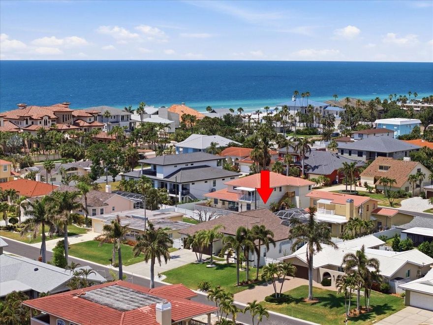 Coastal living at its finest in Belleair Beach! This beautifully updated single-story residence is perfectly positioned on a 10+ ft elevation, offering peace of mind with no history of storm damage or flooding. Just a few blocks from your private Gulf beach access, this home blends luxury, comfort, and the ultimate Florida lifestyle.

Nestled on a highly desirable street, residents enjoy access to a rare waterfront park complete with a community dock and easy water access—ideal for kayaking, paddle boarding, or simply taking in serene coastal sunsets.

Step inside to a bright, open floor plan with 10-ft ceilings throughout, creating an airy, expansive feel. High-end finishes include luxury plank flooring, designer touches, and integrated smart home technology. The chef-inspired kitchen is a true showpiece, featuring quartzite countertops, custom wood cabinetry, premium KitchenAid stainless steel appliances, and an oversized island with ample seating, perfect for casual dining and entertaining.

The spacious living area centers around a gas stone fireplace and flows seamlessly to a heated, screened-in pool and private outdoor retreat. Enjoy year-round comfort with a new gas pool heater, making it ideal for relaxing or hosting guests in any season.

The primary suite offers a tranquil retreat with dual walk-in closets and a spa-like ensuite bath featuring imported custom Spanish tile, a soaking tub, walk-in shower, and dual vanities. The secondary bathroom is equally refined with matching imported tilework. All bedrooms include built-in closets, providing both style and functionality.

Additional highlights include a rare 3-car garage with EV charger and dedicated golf cart space, indoor laundry room, plantation shutters, whole-home SONOS sound system, and smart security and thermostat features for modern convenience.

Located just minutes from pristine beaches, top-rated dining, boutique shopping, and local marinas, this move-in ready home is packed with upgrades and perfectly suited for enjoying the best of coastal Florida living. Don’t miss this exceptional opportunity!