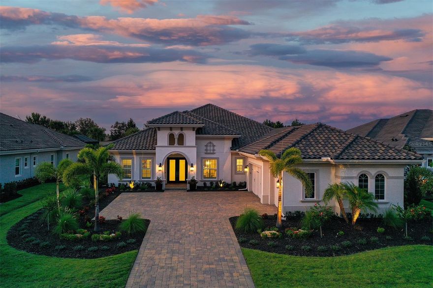 Welcome to 7838 Bowspirit Way, a breathtaking custom estate nestled in the exclusive gated community of The Lake Club in Lakewood Ranch. This immaculate five-bedroom, four-bathroom residence, completed in December of 2023, has been thoughtfully enhanced with over $700,000 in builder and designer upgrades, seamlessly combining timeless craftsmanship, modern elegance, and state-of-the-art smart home technology. The versatile fifth bedroom is also an ideal flex space with soaring 12 ft. ceilings, a wet bar, and a wine fridge. Throughout this stunning home, you'll find designer-upgraded tiles in every bathroom, quartz countertops with extra-thick 3-inch edges, hardwood flooring, and custom cabinetry featuring beautiful stacked uppers in the kitchen. Just off the kitchen is an upgraded dry bar with wine fridge and glass cabinets for stemware, perfect for the connoisseur.  The owner’s suite features an upgraded tray ceiling, extra-large windows, direct access to the lanai, two large custom-built walk-in closets, a luxurious bath with dual vanity, an oversized rain shower, and a large soaking tub. The additional bathrooms include frameless glass shower doors and elegant finishes. Hurricane-impact-rated windows, doors, and sliders, along with plantation shutters, a tankless water heater, a whole-house water softener and filtration system, spray foam insulation, 8-inch baseboards, and epoxy-coated garage floors, provide lasting comfort and quality. The garage also features custom cabinets for extra storage, as well as an outlet for an EV charger.  A true smart home,  including integrated lighting, door locks, thermostats, garage doors, an alarm system, and six exterior cameras — all controlled via app. The Sonos sound system features 16 speakers, amplifiers, subwoofers, and soundbars throughout the home, including the lanai and garage.  There is an additional 7.1 surround sound in the expansive main living area . The home is also equipped with high-end LG OLED TVs throughout. Outdoor living is redefined with a custom-designed pool, waterfall bowls, sun shelf, modern infinite edge spa, and a Pentair saltwater system. The expansive Lanai features an upgraded panoramic screen, a custom-built outdoor kitchen with upgraded built-in cabinetry, a granite countertop island, a Delta Heat grill, a side burner, dual beverage refrigerators, a 42-inch hood, and a large sink. A floor-to-ceiling porcelain fireplace creates a sophisticated atmosphere for entertaining.  This home also features upgraded landscaping and lighting, as well as custom-built-in closets in the office, bedrooms, mud room, and pantry.  This thoughtfully designed residence offers the ultimate in luxury, functionality, and peace of mind—all set within The Lake Club's exclusive guard-gated community featuring a grand clubhouse with fine and casual dining, a bar for social gatherings, a state-of-the-art fitness center, yoga studio, a relaxing spa, multiple sports facilities, including har-tru tennis and pickleball courts, as well as two resort-style pools, a yoga lawn, and interlinking lakes for kayaking or fishing, in addition to a playground and dog park.  A full-time activities coordinator ensures a lively calendar of events. This exquisite neighborhood is also conveniently located minutes to top-rated schools, UTC Shopping District, Waterside Place, and stunning Gulf Coast Beaches! This is a must-see!!