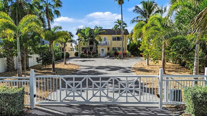 SUN, SURF, SERENITY, and SPECTACULAR SUNSETS define this exceptional Indian Shores beachfront residence. Set on a rare .39-acre Gulf-front parcel, this private retreat delivers 63' of direct beach frontage and endless possibilities. Combining timeless coastal comfort with remarkable versatility, the property is ideally suited as a primary residence, vacation home, income-producing rental property, or development parcel. Current zoning and building codes may allow the construction of up to five new units on this expansive 63’ x 203’ beachfront lot, offering maximum flexibility for future development or expansion. Enter through a custom remote-controlled gate to your private, two-story seaside home with direct access to your own stretch of pristine beach. This solid concrete construction residence offers both durability and peace of mind. With its newer storm rated PGT custom windows and doors, the home sustained minimal impact from Hurricanes Milton and Helene. The property has been cherished by a single family for decades, and thoughtfully updated inside and out. New tropical landscaping is featured on both the front and beachside, along with enhanced landscape lighting that highlights the elegant palm trees and walkways, and further elevates the home’s coastal appeal.The home is perfectly designed for multigenerational living, in-law accommodations, or short- and long-term rental use. Each level features its own entrance, creating a true sense of privacy for owners and guests alike, all while enjoying sweeping Gulf views. 
The property is configured as two full, condo-style living spaces with a total of five bedrooms and four baths. The lower level offers two bedrooms and two baths, and was fully renovated in 2025. Upgrades include updates to the electrical system, fresh paint and new flooring throughout, 4" baseboards and new custom cabinetry in the kitchen, bathrooms and laundry room. The kitchen features luxury quartzite countertops and plenty of counter space including a huge kitchen island.The master bath features an oversized jetted tub. This level also offers dual A/C units, a separate laundry room, Plantation shutters and remote-controlled shades on the oversized west-facing windows.The upper level serves as a tranquil sanctuary, complete with two private balconies overlooking the Gulf and partial Intracoastal. This level offers stunning water views, three bedrooms and two full baths, a spacious living area with gorgeous electric fireplace, a full kitchen with granite countertops and high bar, and separate utility room. Upgrades include fresh paint throughout, Plantation shutters and remote-controlled shades. On both levels, the open-concept design is bathed in natural light from oversized windows that beautifully frame vibrant sunsets and welcome refreshing Florida breezes. Whether envisioned as a legacy beachfront estate, a multigenerational retreat, a high-performing rental investment, or the site for a newly built Gulf-front masterpiece, this one-of-a-kind Indian Shores property epitomizes coastal living—where every day is shaped by sun, surf, serenity, and unforgettable sunsets. Conveniently located near renowned restaurants, medical facilities, top-rated schools, major interstates, and two international airports, this private seaside haven is ready to welcome you home.