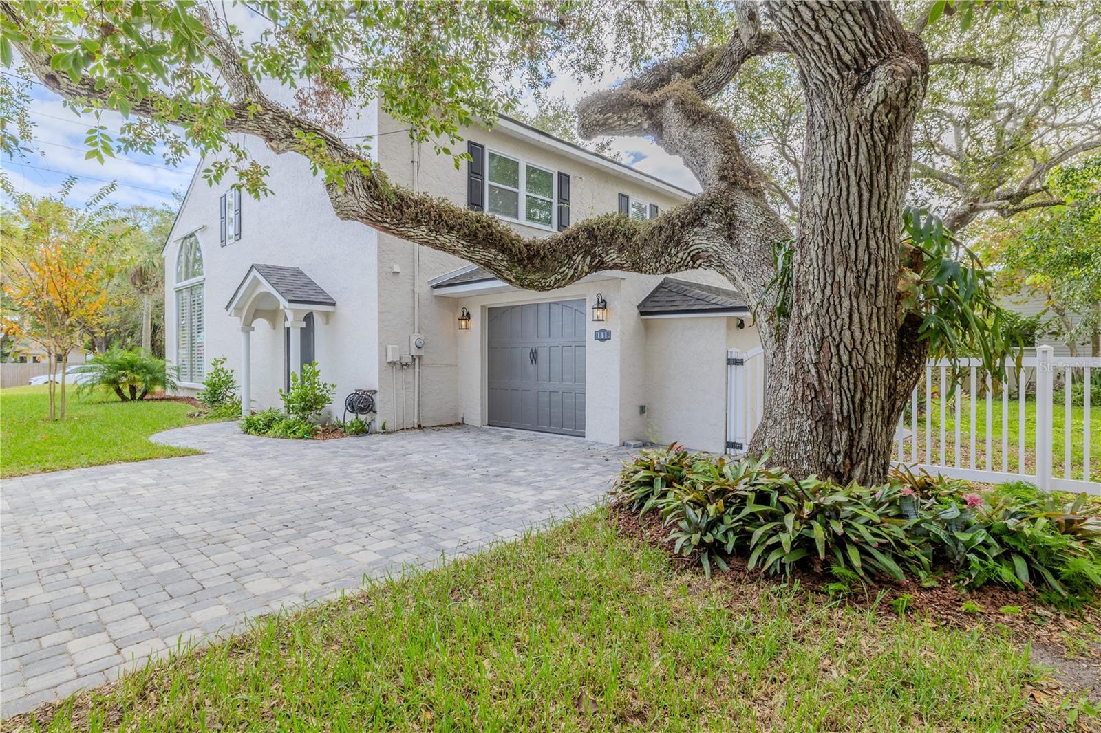Timeless Elegance Meets Modern Sophistication: Welcome to One Eleven Esther Street!
Discover a custom beachside masterpiece in the heart of New Smyrna Beach. Located on an oversized corner lot, just one block from Flagler Avenue, three blocks from beach access, and steps from the river, this home offers the perfect blend of rustic charm and contemporary luxury.
Inside, vaulted ceilings, hand-sculpted moldings, rich hardwood floors, and dramatic archways set a warm yet breathtaking tone. Thoughtfully designed for both grand entertaining and intimate gatherings, the home features light-filled living spaces with expansive windows, French doors, and airy balconies.
Upstairs, the primary suite is a serene retreat with a spa-like ensuite and dressing area, while two additional bedrooms—one with an ensuite—provide charm and comfort.
The backyard, framed by majestic live oaks, provides a private oasis for outdoor entertaining or quiet relaxation. Residents also enjoy a semi-private drive leading to a deeded waterfront access point, ideal for kayaking or soaking in sunsets. This home has no history of flooding or hurricane damage.
Roof replaced in 2022. New windows, new appliances, updated bathrooms, and fresh paint inside and out! 4 point inspection completed in 2025.
This is a rare opportunity to own a truly unique home that defines elevated beachside living.
New Smyrna Beach: A Coastal Haven of Art, History, Cuisine and Natural Beauty
Nestled along shimmering shorelines of the Atlantic Ocean and the Intracoastal Waterway, this charming beach town is a true gem for lovers of art, music, history, and coastal living. Known for its vibrant art culture, the town is alive with galleries, studios, and murals that reflect the creativity of its community. Regular art walks and festivals bring visitors and locals together to celebrate its rich cultural heritage.
With a laid-back atmosphere, boutique shops, local eateries (as featured on popular TV shows) this beach town offers a perfect blend of relaxation, inspiration, and adventure. Whether you’re soaking in the local art and music scene, enjoying the powdery sandy beaches, endless dining options, or exploring the natural beauty of our local state parks, it’s a destination that feels like a step back in time—yet vibrantly alive with creativity and coastal charm.