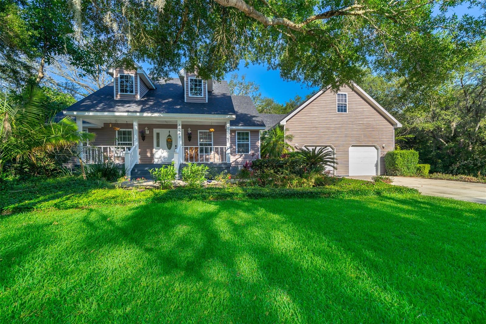 Come and enjoy country living at it's finest!! This lovely farmhouse sits on just under 2 acres of land that is private and beautifully landscaped. The entirety of the property is fenced in with a privacy hedge and sprinkler system. This lovely farmhouse is located just minutes from downtown Eustis where you can enjoy local shopping, mom and pop restaurants plus tons of events for the family every month. The local stores like WalMart and Publix are just a few miles down the road so you get to enjoy the peace and solitude of country living with everything you need at your fingertips. This beautiful home boasts a SUPER SIZED bonus room on the second floor, that could be an office/bedroom/apartment. The owner just replaced the roof in 2023 and the AC system with a Trane unit. Make your appointment today this lovely home will not last!