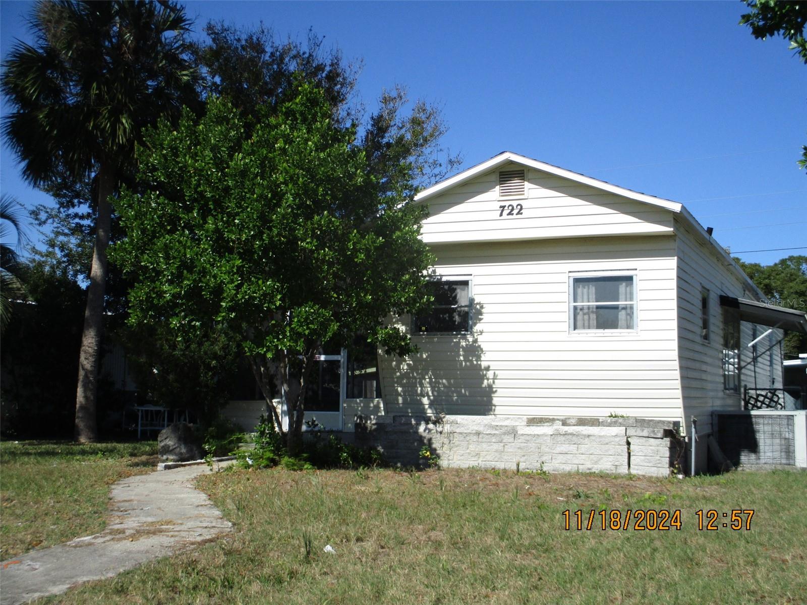 This charming 1-bedroom, 1.5-bathroom, mobile home offers versatile living with an additional flex room that can serve as a bedroom, office, or playroom. Enjoy a relaxing screened porch and the convenience of owning your own land—no park fees. Ideal as a primary residence or investment property, this home features two on-site sheds, providing ample storage and a large laundry room. Its location is close to major roads, shopping centers, beaches, and Central Florida attractions. With several major colleges nearby, it also makes a perfect, affordable option for anyone seeking an alternative to renting. No Flooding.