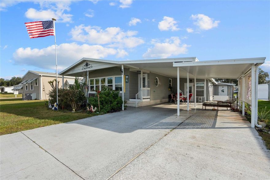 Escape the cold and embrace effortless Florida living in this beautifully maintained, move-in-ready residence, where thoughtful updates and generous spaces create a refined yet relaxed lifestyle. Designed for those who value comfort, quality, and a true sense of community, this home is equally suited for discerning snowbirds or full-time residents.  Located in sought-after Betmar Acres, this 1987 home offers two bedrooms, two full bathrooms, and a spacious, light-filled layout. The expansive front living area (25’ x 15’) features a tiled entryway and a stunning wall of windows, creating an inviting space ideal for entertaining or quiet afternoons at home.  At the heart of the home, the fully renovated kitchen impresses with stylish white cabinetry featuring soft-close doors, glass knob hardware, stainless steel appliances, a tile backsplash, and a skylight that bathes the space in natural light. Just beyond, a thoughtfully designed hallway includes a built-in desk area and a new washer and dryer, leading to the versatile Florida room.  The Florida room (17’ x 12’) is beautifully finished with beadboard accent walls, custom wood window trim, and a wall-mounted television. Whether used as a third sleeping area, private studio, or relaxed retreat, this space adapts effortlessly to your lifestyle.  The dining area is open to both the kitchen and living room and features an impressive wall of built-ins with cabinetry and lighted glass shelving—perfect for displaying cherished pieces. The primary suite, located at the rear of the home, comfortably accommodates a king-size bed and offers dual walk-in closets, along with a charming doggie door for your furry companions. The updated ensuite bath features a dual-sink vanity and a brand-new walk-in shower. The guest bedroom is equally spacious and also accommodates a king-size bed.  Cathedral ceilings throughout enhance the home’s open, airy feel. Hardwood flooring flows through the main living spaces and bedrooms, complemented by ceramic tile in the kitchen and baths, wood-look vinyl flooring in the laundry area and luxury vinyl plank flooring in the Florida room.  Outside, the home offers aluminum siding, brick skirting, a shingle roof and all new Thermopane E-glass double pane windows. Two attached sheds provide excellent functionality—one currently serving as a workshop and the other for additional storage. Enjoy both front and back patios to follow the Florida sunshine, along with a double driveway for added convenience. The home is being sold furnished, with a few exclusions.  As a resident of Betmar Acres, you’ll enjoy an exceptional amenity package including three beautifully maintained nine-hole golf courses, two swimming pools with hot tubs, 24 covered shuffleboard courts, 12 pickleball courts, and a wide variety of activities and facilities for residents and guests.  Now is the time to make 5750 Pawnee Street your Florida retreat—where comfort, craftsmanship, and community come together.