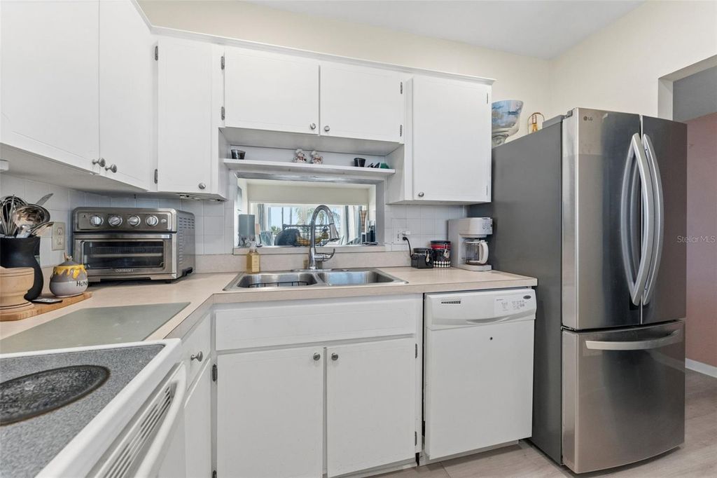 Photo of 10215 Regal Drive #56, Largo, FL 33774 (MLS # TB8490307)