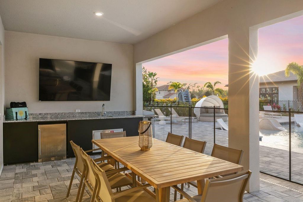 Photo of 1008 Coyote Creek Way, Reunion, FL 34747 (MLS # O6394529)