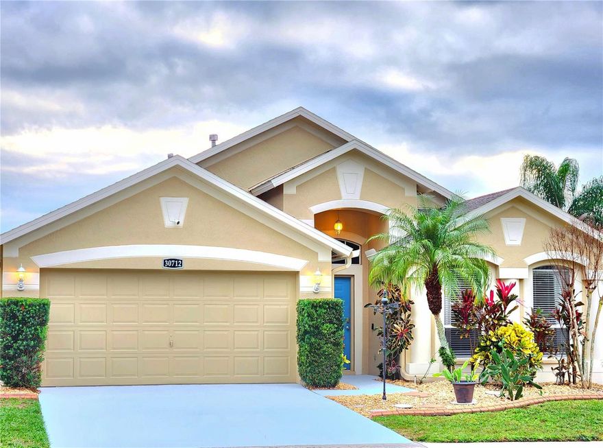 WHAT AN INCREDIBLE LOCATION! Positioned on a quiet street, this BEAUTIFUL POOL HOME is situated just north of Tampa inside the well-established and GATED COMMUNITY of Wrencrest (within Meadow Pointe 2), right in the heart of Wesley Chapel!!!  Residents have access to the community's amenities, which include club house, fitness center, large pool w/ splash pad, covered playground, basketball, pickleball, and tennis courts, all included in the $1,765.75 yearly ($147.15 monthly) CDD fee. NO HOA!!!!!! This home is also within in the area's most desired school zone, being less than 1.5 miles from the elementary, middle, high school, AND state college, putting them all within walking/biking distance. Essentials are very close by; only a 10 min drive to Publix Grocery, Target, Walmart, and Sam's Club. The area also features two newer malls, three new hospitals, and hundreds of retail and dining options (including a brewery and winery). ----Step inside and you'll see this is a TRUE 4-BEDROOM HOME with closets in each room, one of which has double doors off the kitchen and can make for a nice office if needed. Entertaining areas are abundant, with separate dining room, living room, family room, breakfast nook, and a bar height counter area in the large kitchen. The standout for this property is the BIG PRIVATE HEATED POOL (with fountain), covered out-door patio area, fully fenced-in low maintenance backyard with tropical plants, separate garden area, and gates that allow for easy access to both sides of the house. The pool really sparkles at night with the included pool cage lighting. Get ready to spend lots of time in your own calming oasis! The pride in the property is evident everywhere. There are CUSTOM CLOSET SYSTEMS in each bedroom, maintained landscaping and hardscaping, window treatments, ceiling fans, and upgraded floors throughout (no carpet); bamboo, laminate, and large tile. An added perk is that the water heater and central air both use natural gas, with hookups available for the dryer and stove. All New Exterior Paint was done in 2025 (including house, pool deck, driveway and walkway), NEW ROOF installed in 2020, AC refurbished in 2018, water heater replaced in 2017, new pool pump and salt cell installed in 2020. This fantastic home is move-in ready and waiting for you!