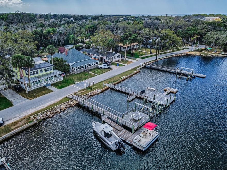 Come for the view, stay for the lifestyle. Located on one of the prettiest streets in Pasco County, welcome to Sunset Boulevard overlooking The Pithlachascotee (AKA Cotee) River. This Waterfront home has direct Gulf access with no bridges so you can bring your sailboat and water toys. There is a large stationary dock, 2 floating docks and a boat lift. Enjoy boating, fishing, scalloping, stone crabbing, blue crabbing, island hopping and the best Sunsets. After a great day on the water cook up your catch in the oversized kitchen which makes entertaining a dream. Just wait until you see the butler's pantry with tons of storage and laundry area. This four-bedroom, five-bathroom home offers approximately 3,005 square feet of well-designed living space. On the first level there is one bedroom and 2 bathrooms. Upstairs you will find an oversized Primary suite with incredible water views.  Also upstairs 2 additional bedrooms and 3 bathrooms plus a second laundry area. Each bedroom in the home has its own private bathroom for convenience and privacy. One of the standout features of this property is the large, in-ground heated pool and spa, offering a refreshing and relaxing outdoor oasis overlooking the fenced backyard. 
An additional 500 square feet of living space is the perfect in-law suite or caretakers' loft, with a separate entrance. Here you will find a loft style layout complete with a kitchenette and full bathroom, providing versatility and flexibility. 

Situated in a quiet residential area, the home is ideal for those seeking a peaceful and tranquil living environment. The community allows the use of golf carts, offering a unique and convenient mode of transportation to nearby attractions. Residents can explore a variety of nearby waterfront parks and dining options, providing ample opportunities for entertainment and leisure accessible by boat, car or golf cart.

For added peace of mind, the home is equipped with a full home generator, ensuring uninterrupted power during potential outages. The metal roof and metal hurricane shutters provide enhanced protection and security, further contributing to the property's overall appeal.

The home is currently operating as a short-term rental and can be utilized for Airbnb or VRBO purposes. Whether you are looking for a great investment or luxury family home don't miss this opportunity, homes in this neighborhood are rarely available.