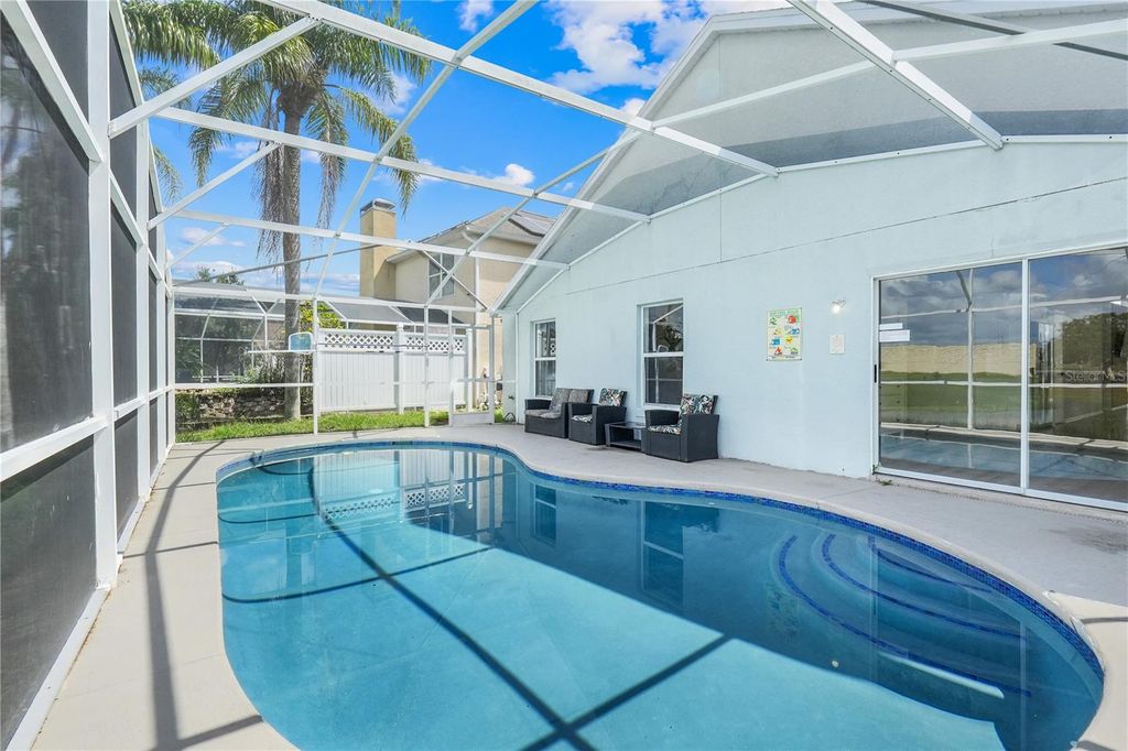 Photo of 203 Lake Davenport Estates Drive, Davenport, FL 33897 (MLS # O6328685)