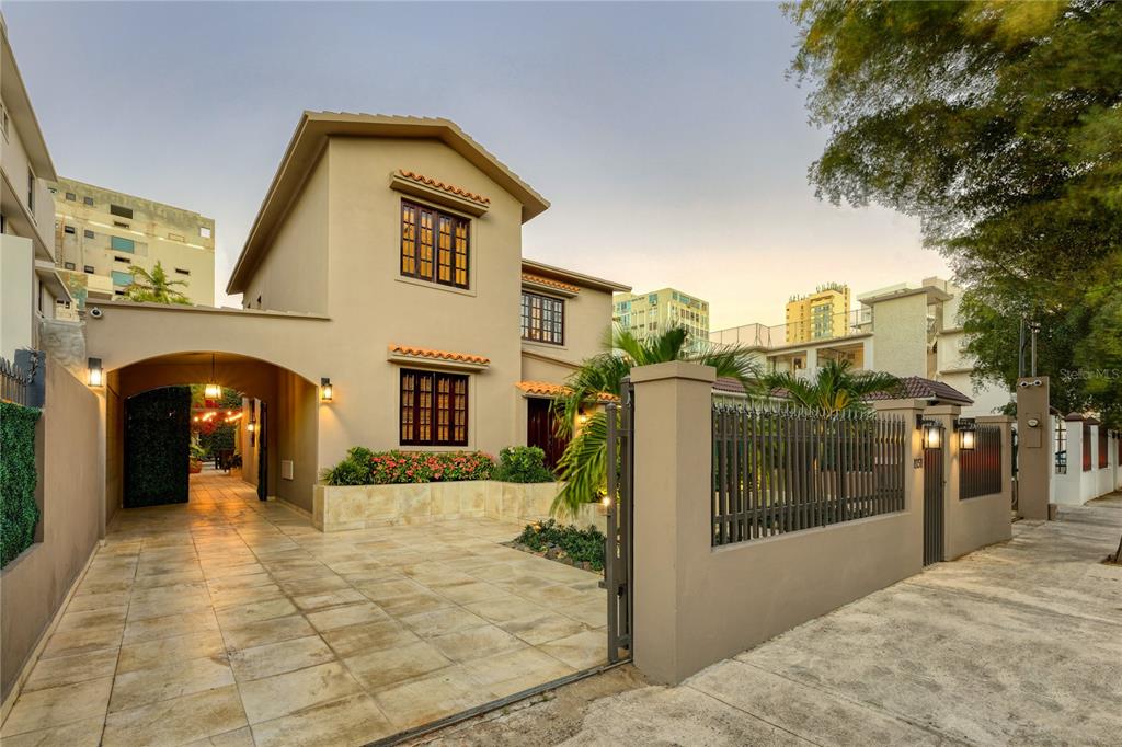 Fully redesigned contemporary colonial with beautiful original details preserved in mint condition. This exquisitely inspired California Mediterranean home in Condado Beach features 3 bedroom plus den, 2 full bath and 2 partial, swimming pool and spa. One block from the beach, nothing compares to this tastefully furnished single family home in both location and privacy. The two story property offers expansive living spaces including indoor-outdoor living rooms, fully-equipped kitchen suite with outdoor passthrough, and Spanish tile throughout. Eye-catching architectural elements such as arched doorways, high ceilings, recessed lighting, oversized rooms and open living make this home a unique find within the district. Bursting with beautiful natural light, each bedrooms' french windows open onto the outdoor living areas, which feature a fully inground swimming pool, Jacuzzi, sunning and dining areas. An adjacent porch also serves as an excellent entertainment space. An office, laundry room, 3-vehicle carport and full-power generator complete this one of a kind residence.
With approx. 6,100 Sq. Ft. of construction including the front and back yards, this oasis in the city will have you swooning with its unparalleled charm and captivating ambience.
Desirably located in the heart of Condado Beach. Within walking distance to top restaurants, entertainment options, shopping venues and some of the best schools. CoBe is a highly-esteemed community within the island's thriving capital. Nearby Isla Verde, Old San Juan and the Miramar Arts District.