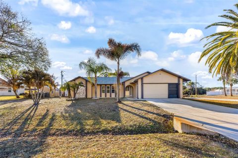 Photo of 100 Seahorse Circle SE, Palm Bay, FL 32909 (MLS # O6380990)