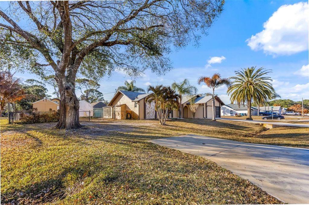 Photo of 100 Seahorse Circle SE, Palm Bay, FL 32909 (MLS # O6380990)