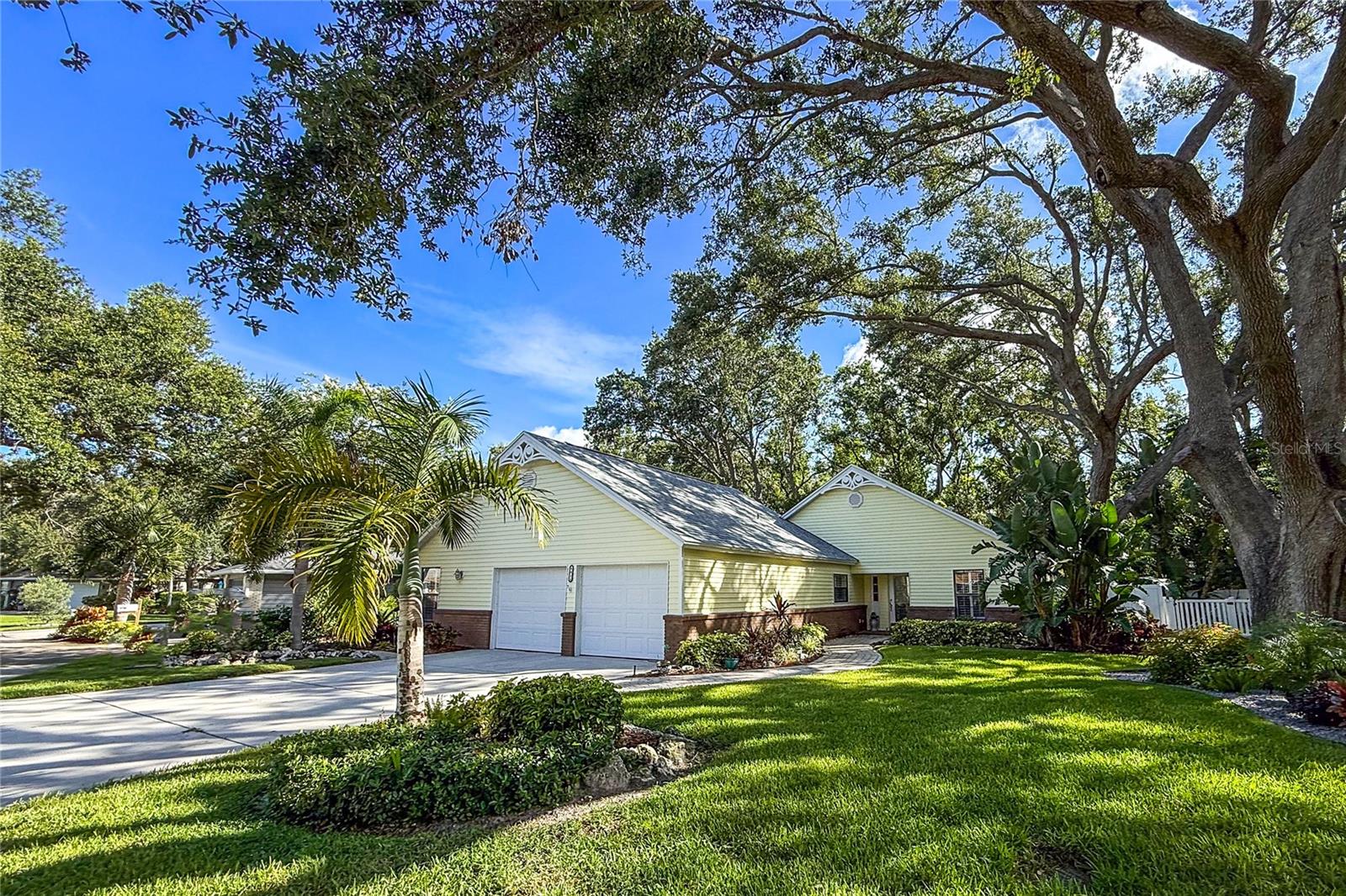 Lush landscaping surrounds this beautiful home in the subdivision of Arbors Oaks. This updated 3 bedroom 2 bath home with a large kitchen off of the dining room. Large wrap around screened- in lanai off of the Primary bedroom and living room. A new roof ,new bathrooms make this a perfect move in ready home. Brand new vinyl fence has recently been installed. Trimming trees, landscaping, irrigation, , cable and community heated pool are included in the monthly fee.