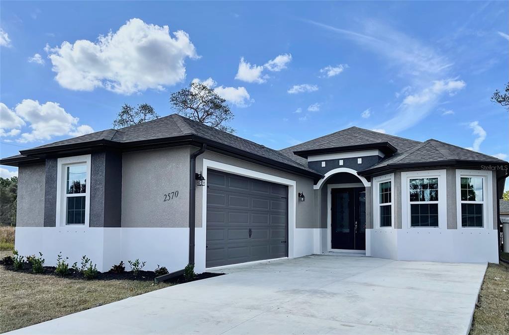 Under Construction. Under Construction! $10K Seller Assistance, can be used for Rate Buy Down or Closing Costs, Buyers Choice! 3/2/2 located in a rapidly growing North Port. Featuring 9.4" high ceilings, 8" interior doors and high end laminate throughout. Close to schools, shopping and I75. Perfect starter home, retirement home or home for anyone best describes this open floor plan. Wood soft close cabinets with granite counter tops in kitchen accompanied by stainless steel appliances and dishwasher. Upgraded finishes like recessed lights and ceiling fans make this a very desired model. Standard 1 year offered. Pictures are from a similar model and finishes may vary. All measurements should be verified by Buyers agent.
