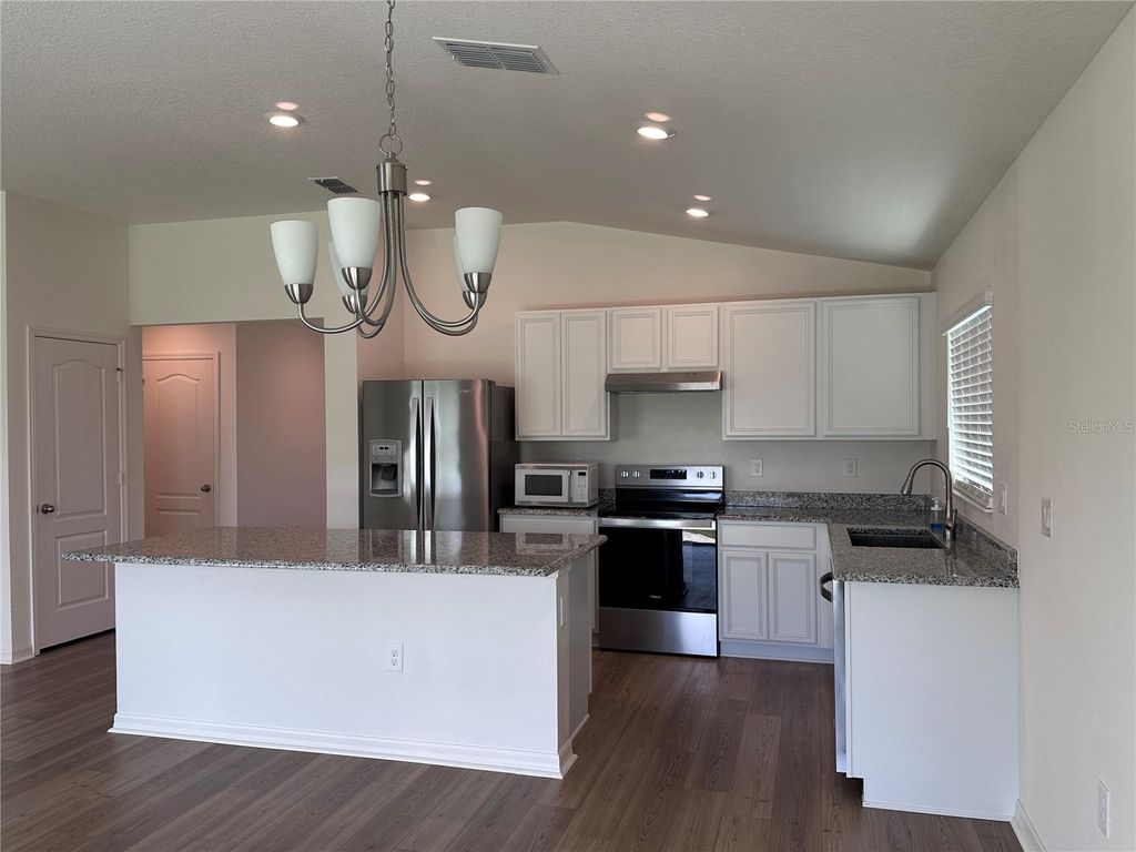 Photo of 148 Summerlin Loop, Haines City, FL 33844 (MLS # O6398419)