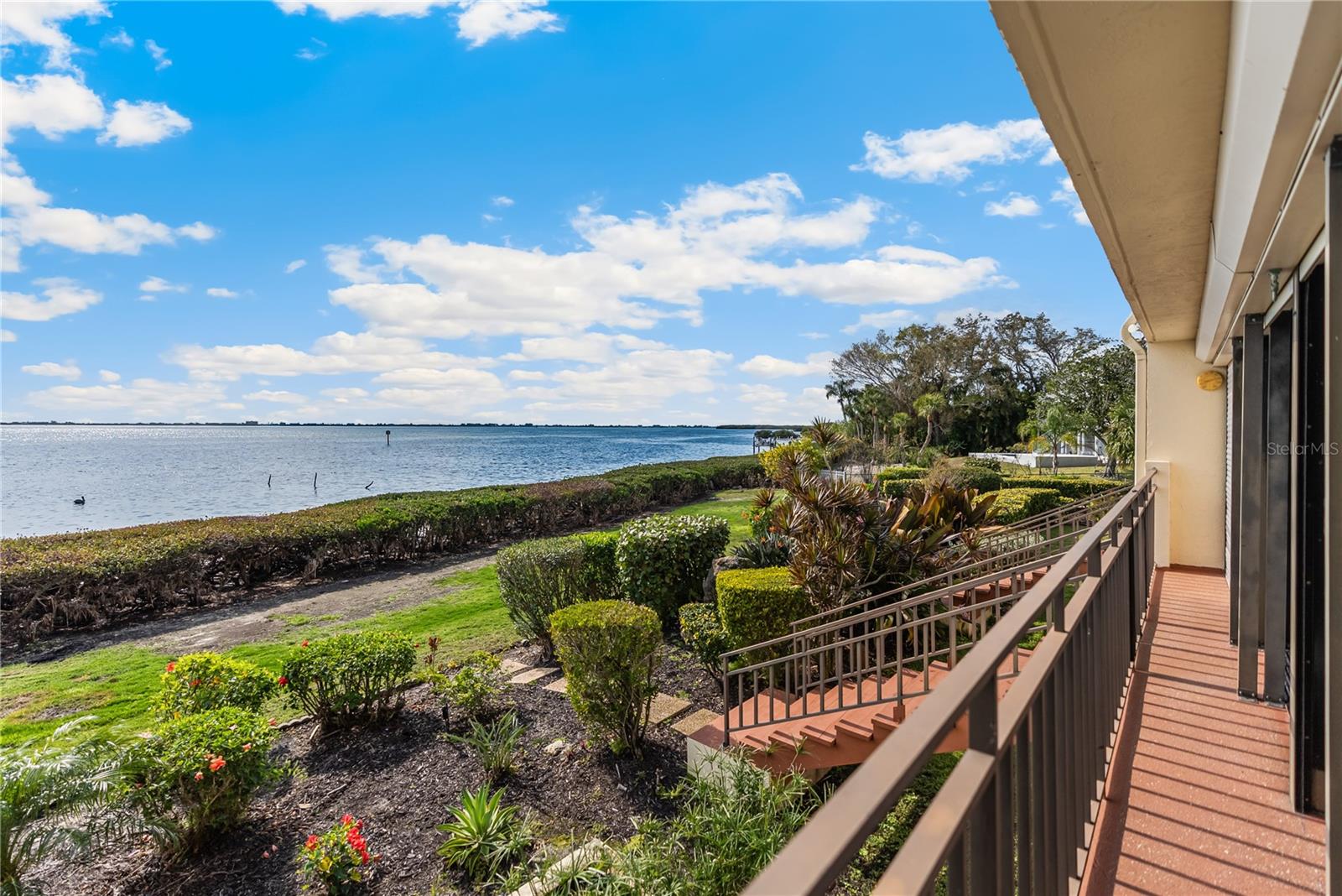 One or more photo(s) has been virtually staged. Welcome to your personal oasis on Sarasota Bay, with million dollar views! This charming 2-bedroom, 2-bathroom condo boasts breathtaking water views at an incredible price. New photos are on the way! The unit has been updated with fresh paint, new dining room fixture, all new ceiling fans, new microwave, new sliding glass door handles and the carpets have been professionally cleaned! Conveniently located near the IMG Golf course, you will enjoy stunning views from your fully enclosed lanai, perfect for all seasons. The expansive open floor plan promotes easy living, ideal for both relaxation and entertaining. Feel free to bring your pets, take a dip in the pool, or step directly from your living room to the bay for a quick kayaking adventure—endless possibilities await! Additionally, you're just moments away from the lively downtown, featuring top-notch restaurants, art galleries, shopping, and the famous beaches. This is a remarkable chance to own a slice of Sarasota Bayfront living at a price that allows you to personalize it! Don’t let this opportunity slip away; schedule your private showing today!