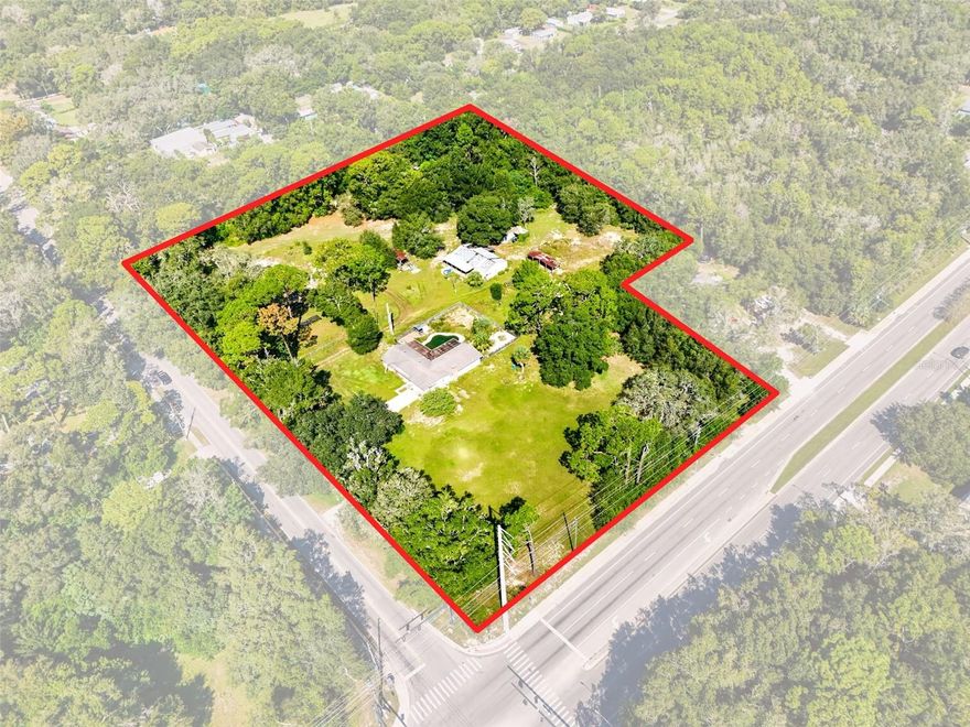 Prime corner location at Rock Springs Road and Ponkan Road! This 5.98-acre property offers exceptional visibility and endless potential in one of Apopka’s fastest-growing areas. Just minutes from the 429/453 toll road connection, Rock Springs Run State Park, the Northwest Recreation Complex, and the Apopka Amphitheater, this property is ideally positioned for development, investment, or a private estate.
The property includes a barn with an apartment, multiple pole barns, and an older home that was given no value in determining the list price — meaning the value is in the land and its future possibilities. Located within 2 miles of Wolf Lake Elementary, Wolf Lake Middle, Rock Springs Elementary, and Apopka High School, it offers excellent convenience for families. With its corner exposure on two major roads and proximity to shopping, dining, and recreation, this acreage is a rare find for builders, investors, or anyone looking to create their dream property.