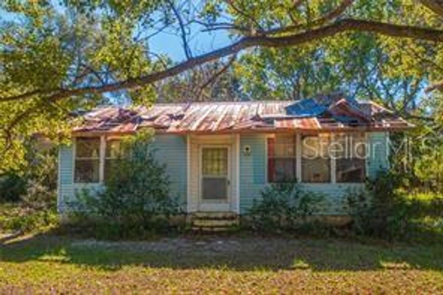Over 1 acre, mobile home on the side with a bis storage. NO HOA,